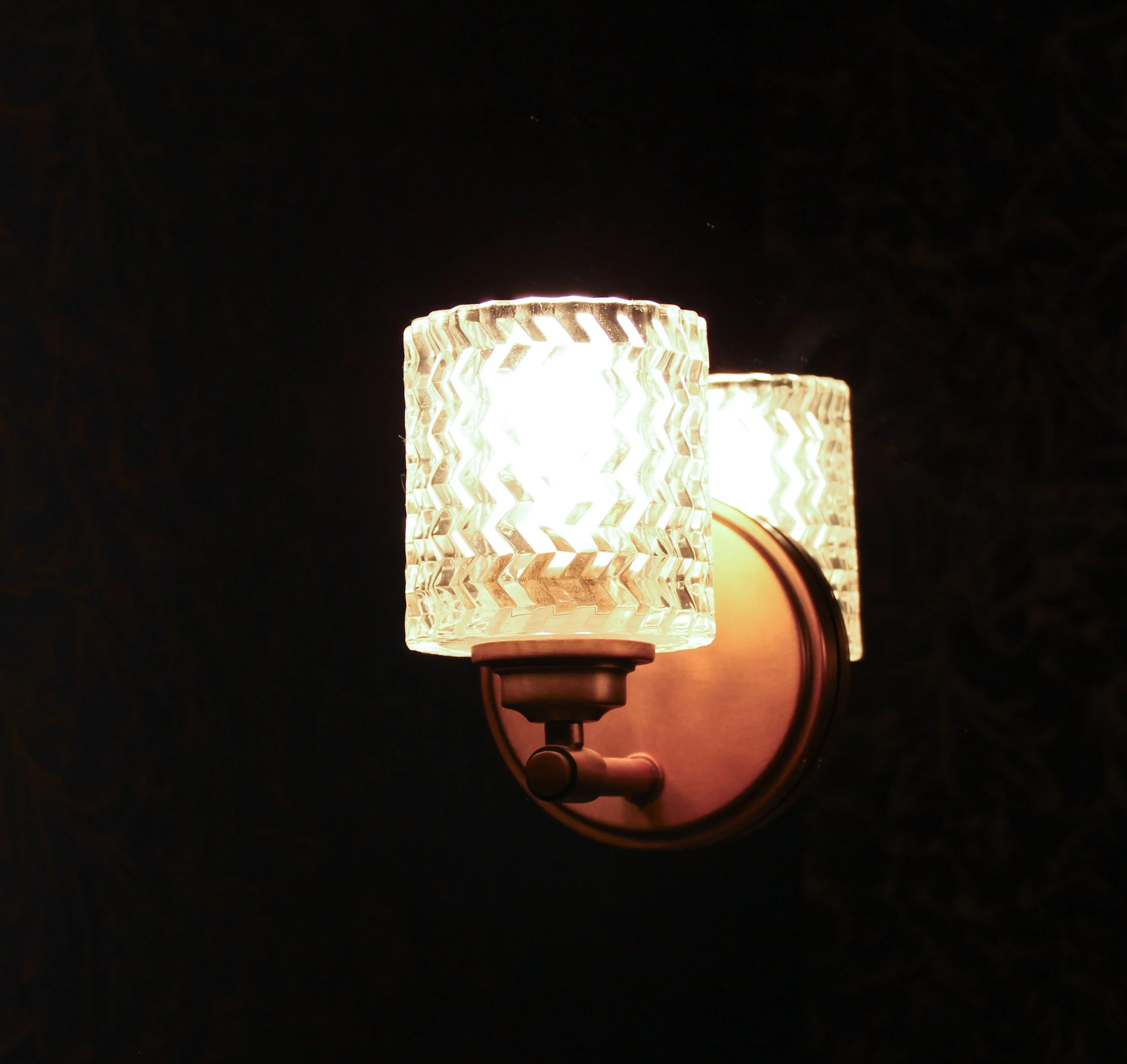 Bathroom wall sconce installation completed by F&M Construction & Remodeling on Mercer Island, WA, featuring designer lighting fixtures and luxury bathroom remodeling serving Bellevue, Seattle, and the Eastside.