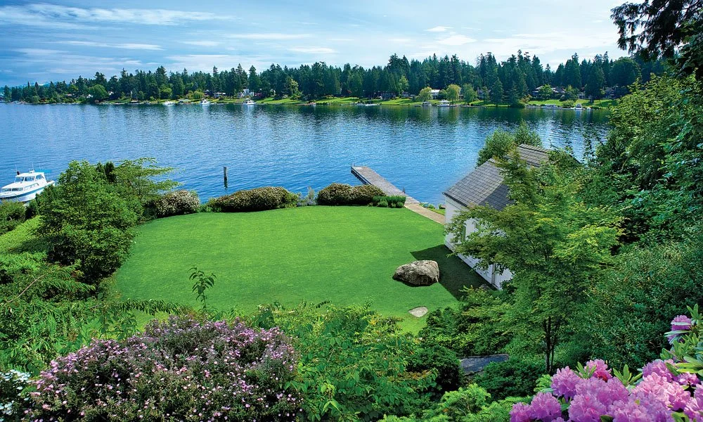 Private waterfront dock and boathouse overlooking Lake Washington in Medina, Washington.