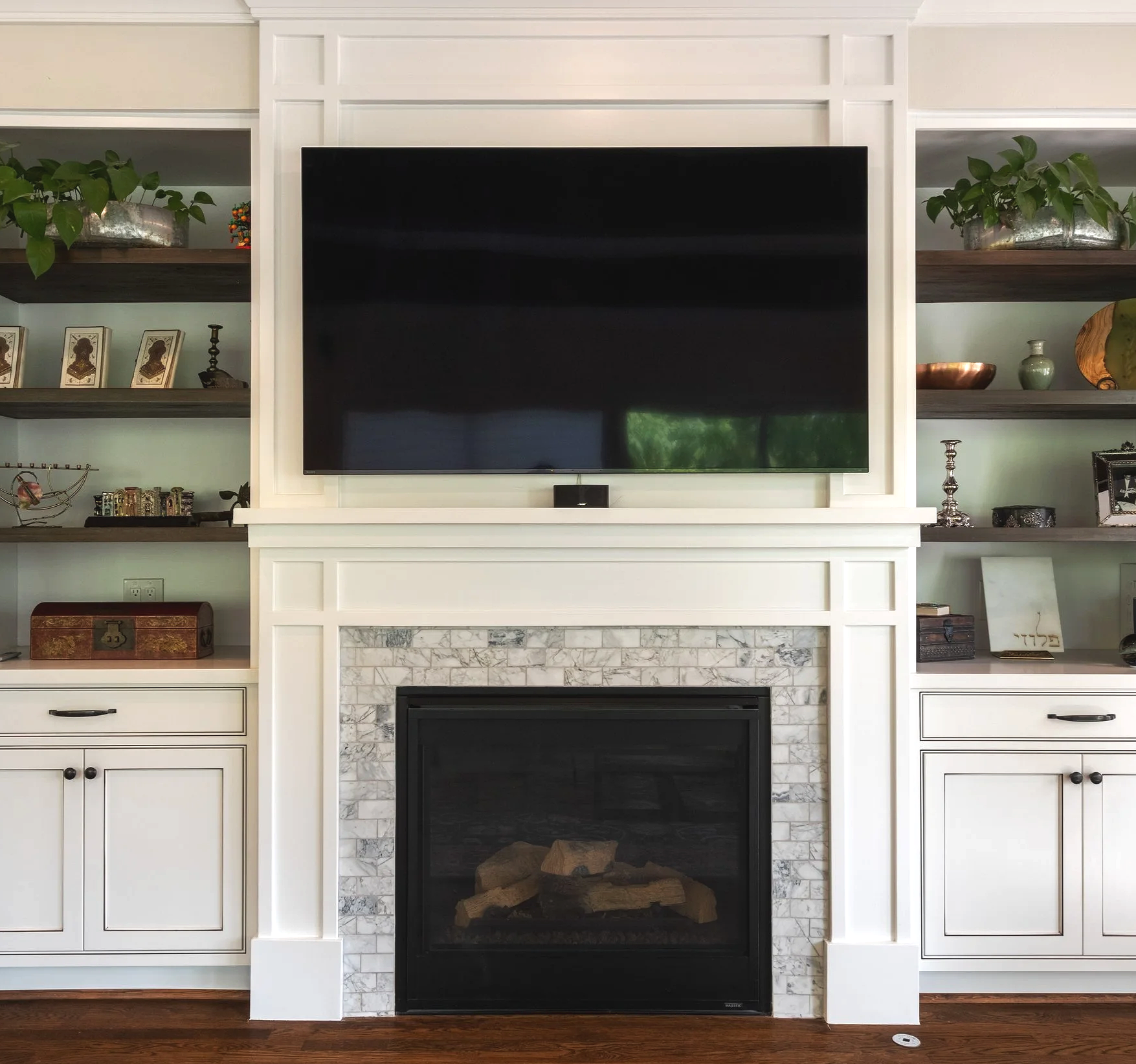 Built-in fireplace entertainment center completed by F&M Construction & Remodeling on Mercer Island, WA, featuring custom cabinetry, fireplace installation, and luxury living room remodeling serving Bellevue, Seattle, and the Eastside.