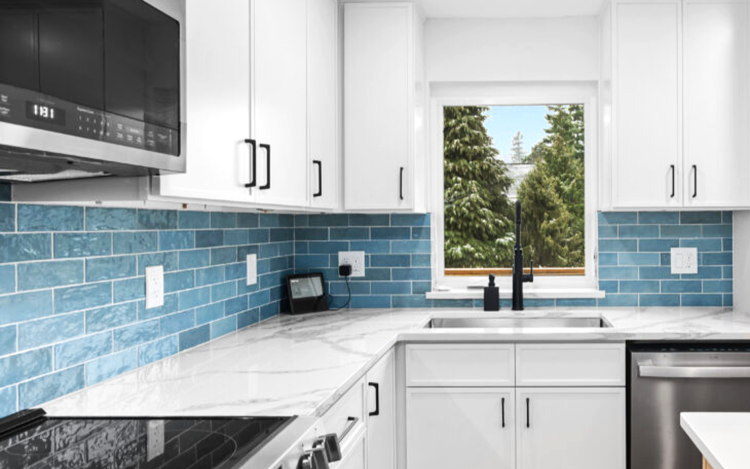 Blue subway tile backsplash installation completed by F&M Construction & Remodeling in Seattle, WA, featuring custom kitchen tile, premium backsplash design, and luxury kitchen remodeling serving Bellevue and the Eastside.