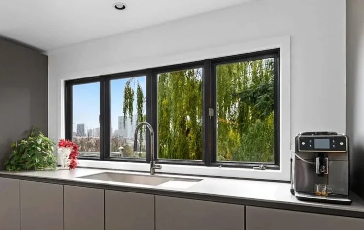 Custom window installation completed by F&M Construction & Remodeling in Bellevue, WA, featuring large energy-efficient picture windows that maximize natural light for luxury home remodeling projects throughout Bellevue, Seattle, and the Eastside.