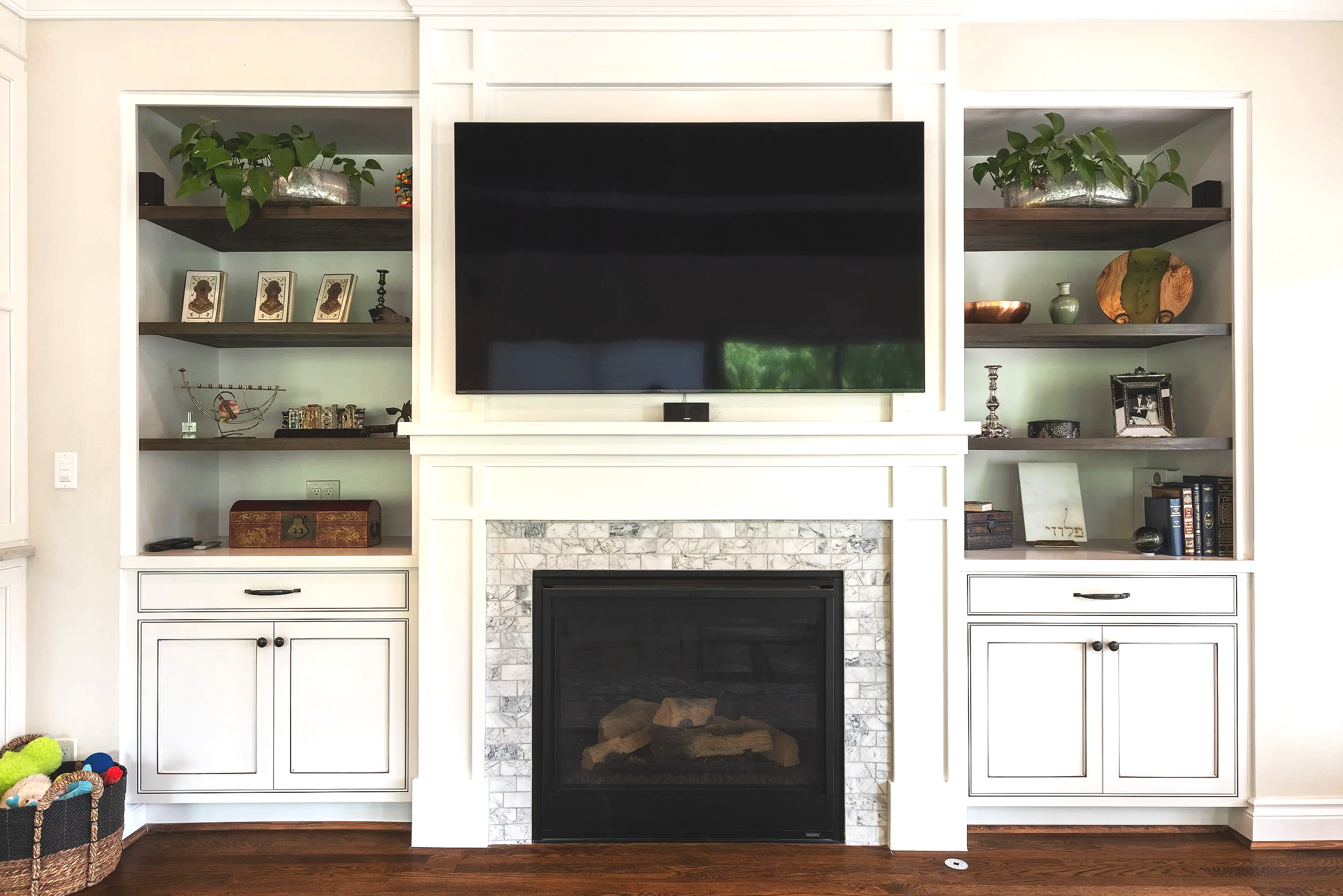 Custom entertainment center and built-in cabinets completed by F&M Construction & Remodeling on Mercer Island, WA, featuring finish carpentry, custom shelving, fireplace surround, and luxury home remodeling serving Eastside homeowners.