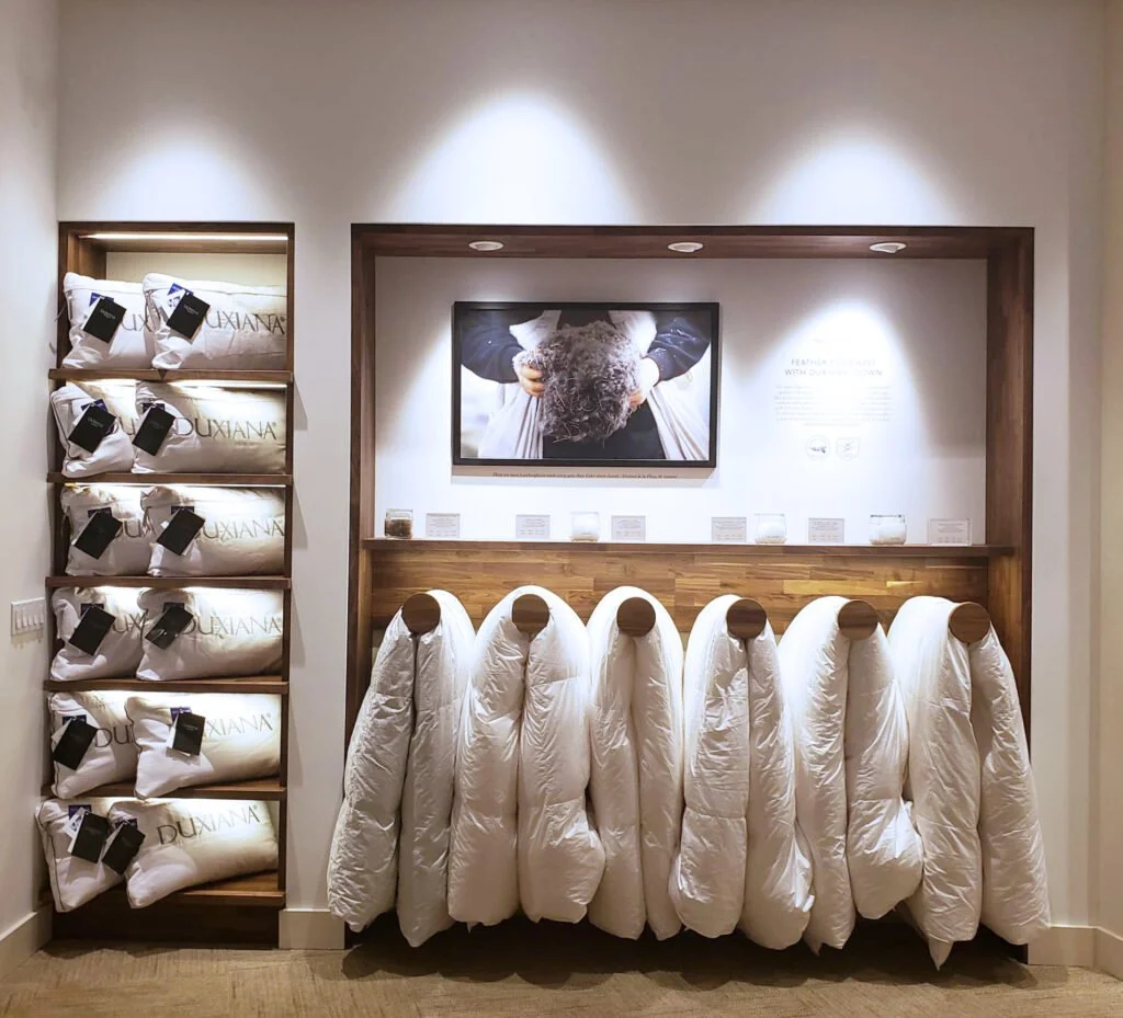 Modern commercial showroom featuring custom retail displays, built-in millwork, premium lighting, and high-end finishes representing the commercial construction services provided by F&M Construction & Remodeling.