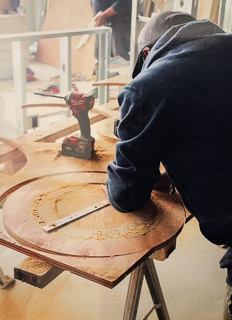 Skilled craftsman performing custom carpentry and home repair work, representing the professional home maintenance services provided by F&M Construction & Remodeling.