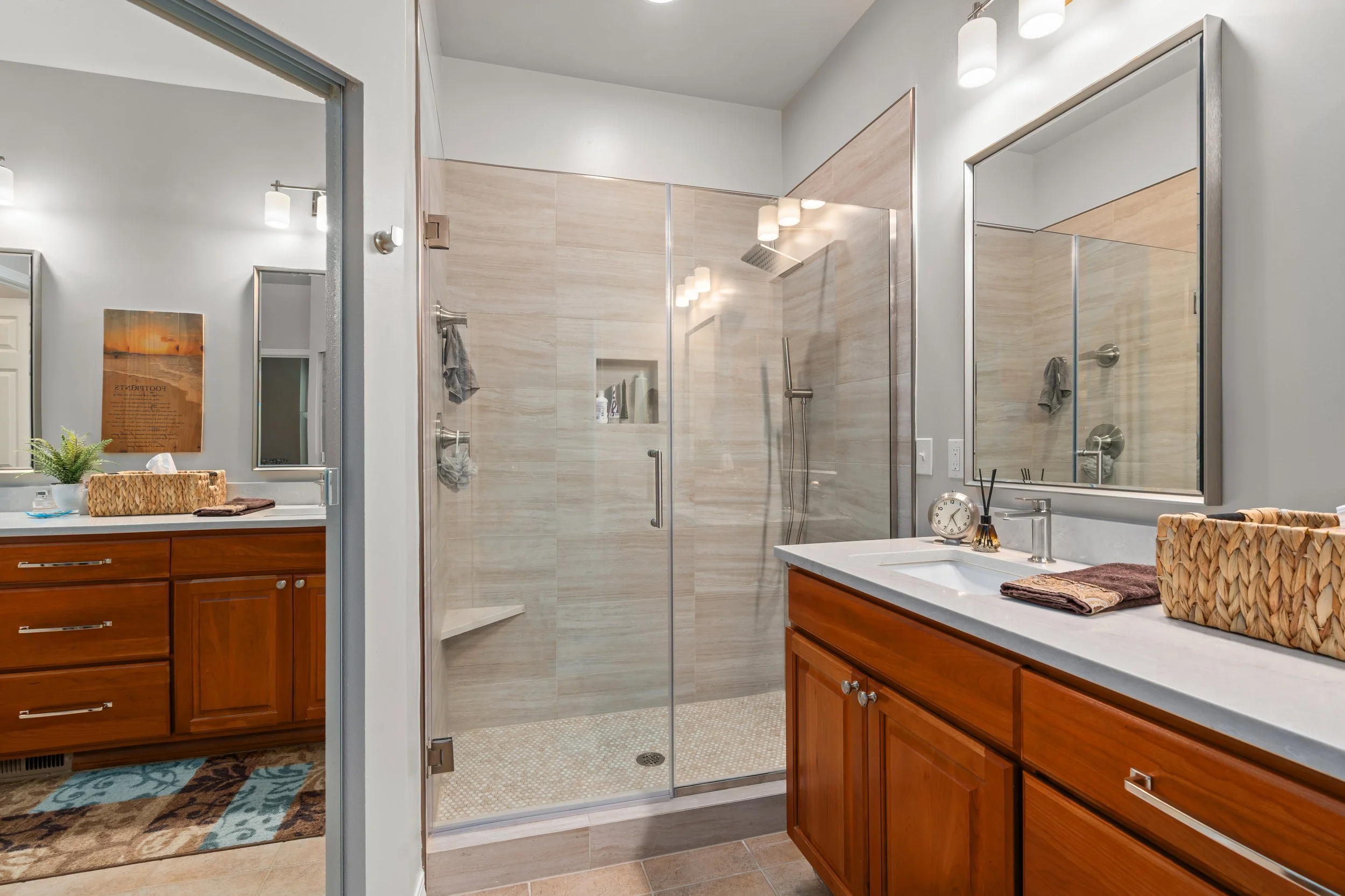 Mollie House Transformation — remodeled bathroom vanity with wood cabinets, quartz countertop and large mirror, Redmond interior remodel