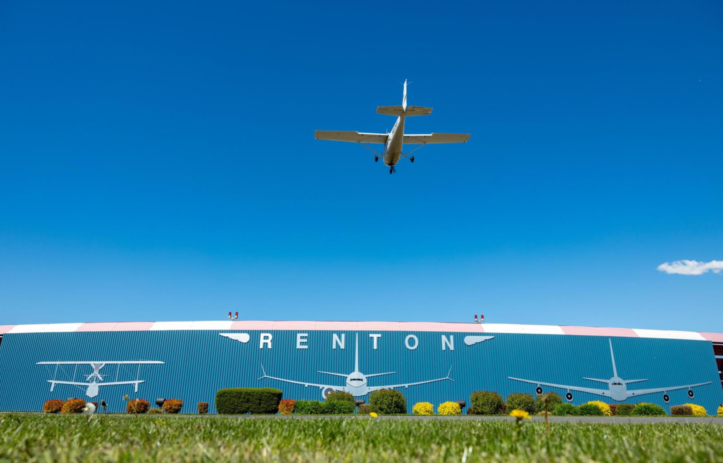 Airplane flying over Renton Municipal Airport in Renton, Washington.