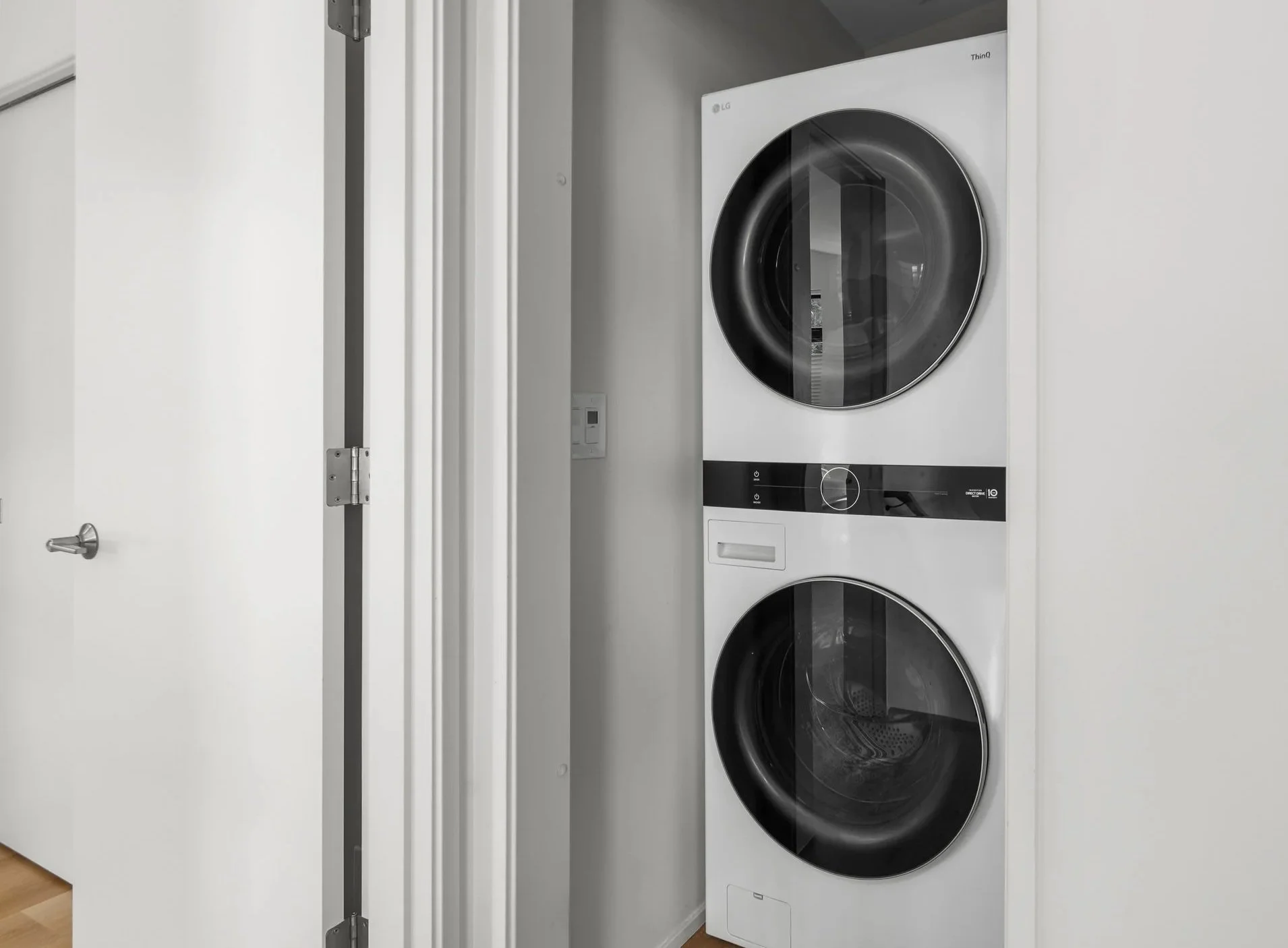 Stacked washer and dryer installation completed by F&M Construction & Remodeling in Seattle, WA, featuring space-saving laundry appliance installation for modern residential remodeling projects.