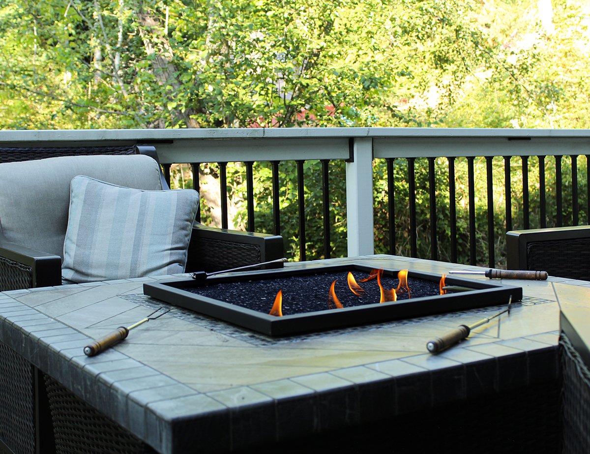 Custom outdoor fire feature installed by F&M Construction & Remodeling on Mercer Island, WA, creating a luxury outdoor living space with integrated fire pit, seating area, and premium backyard entertaining design.