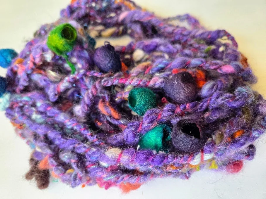 Hand spun Merino yarn with hand dyed silk cocoons
