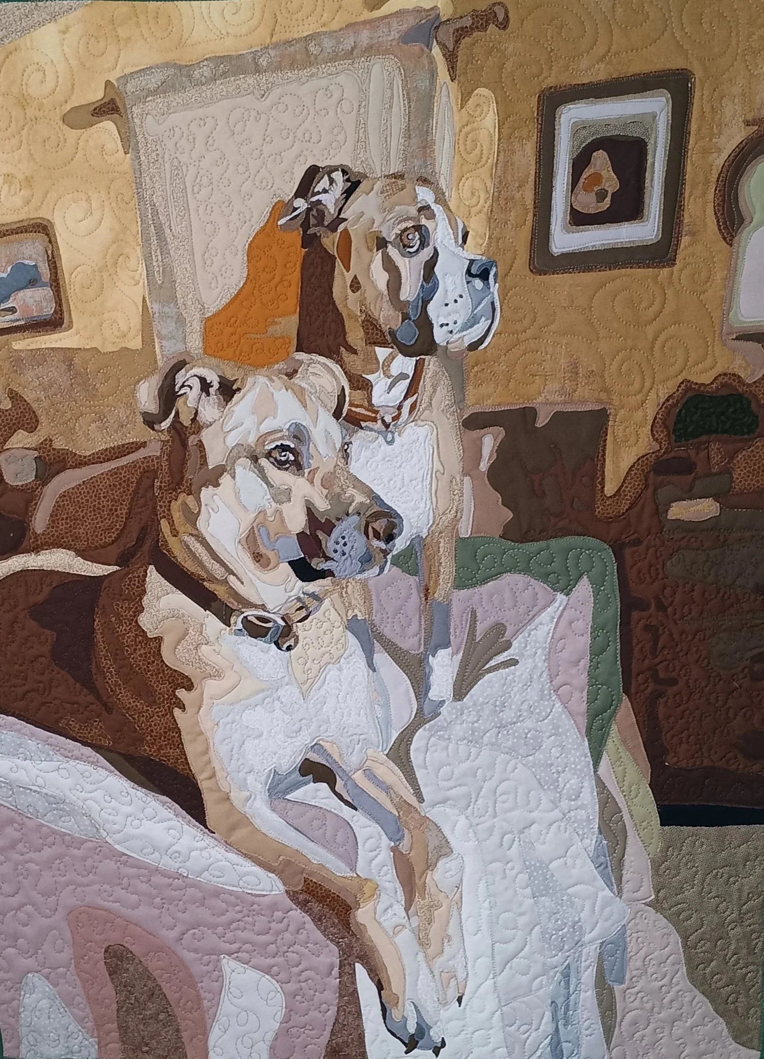 A quilt with an intricate pattern depicting two dogs sitting on a textured background.