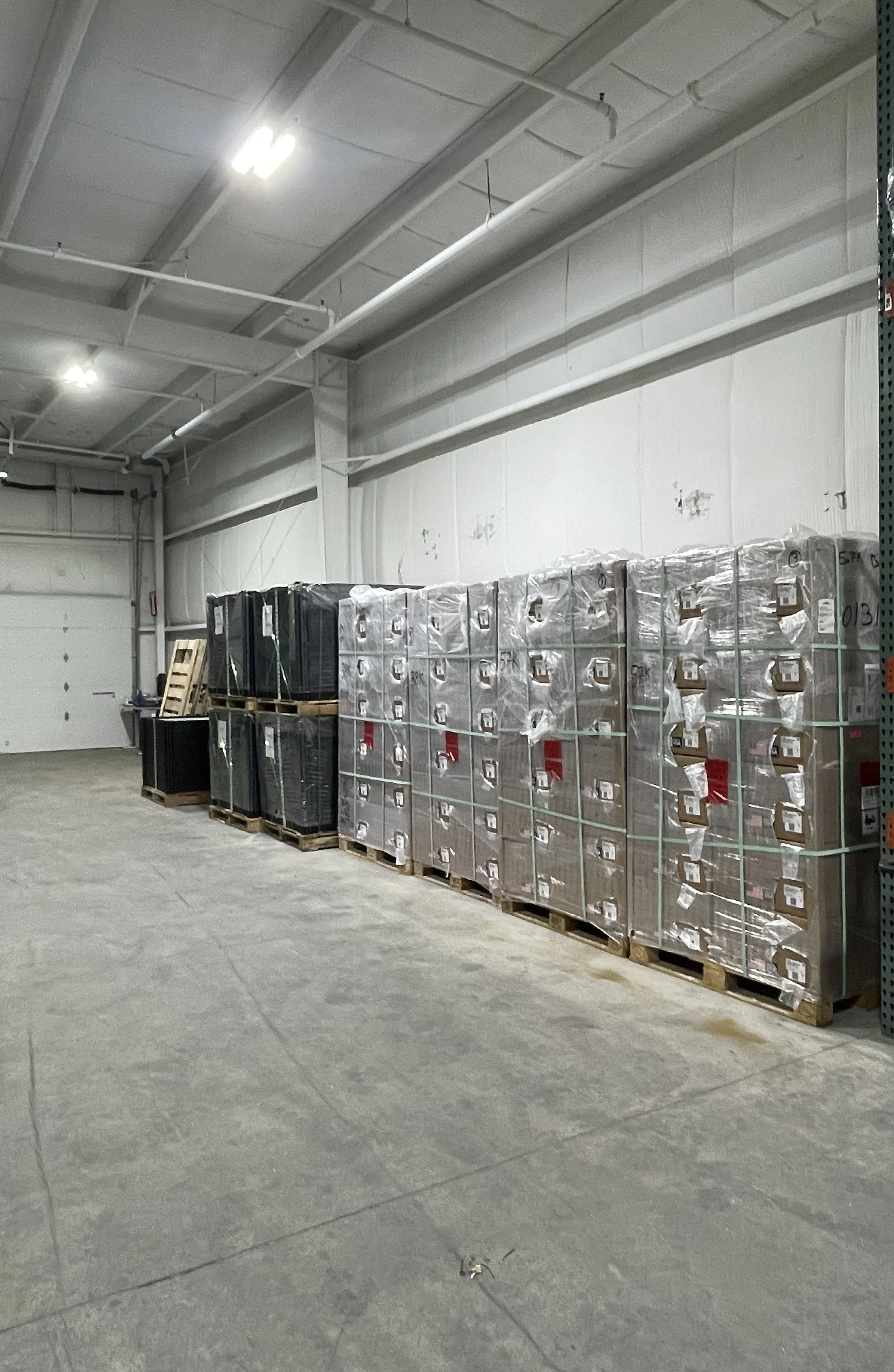 Organized warehouse inventory with palletized products demonstrating efficient warehouse organization and inventory control.