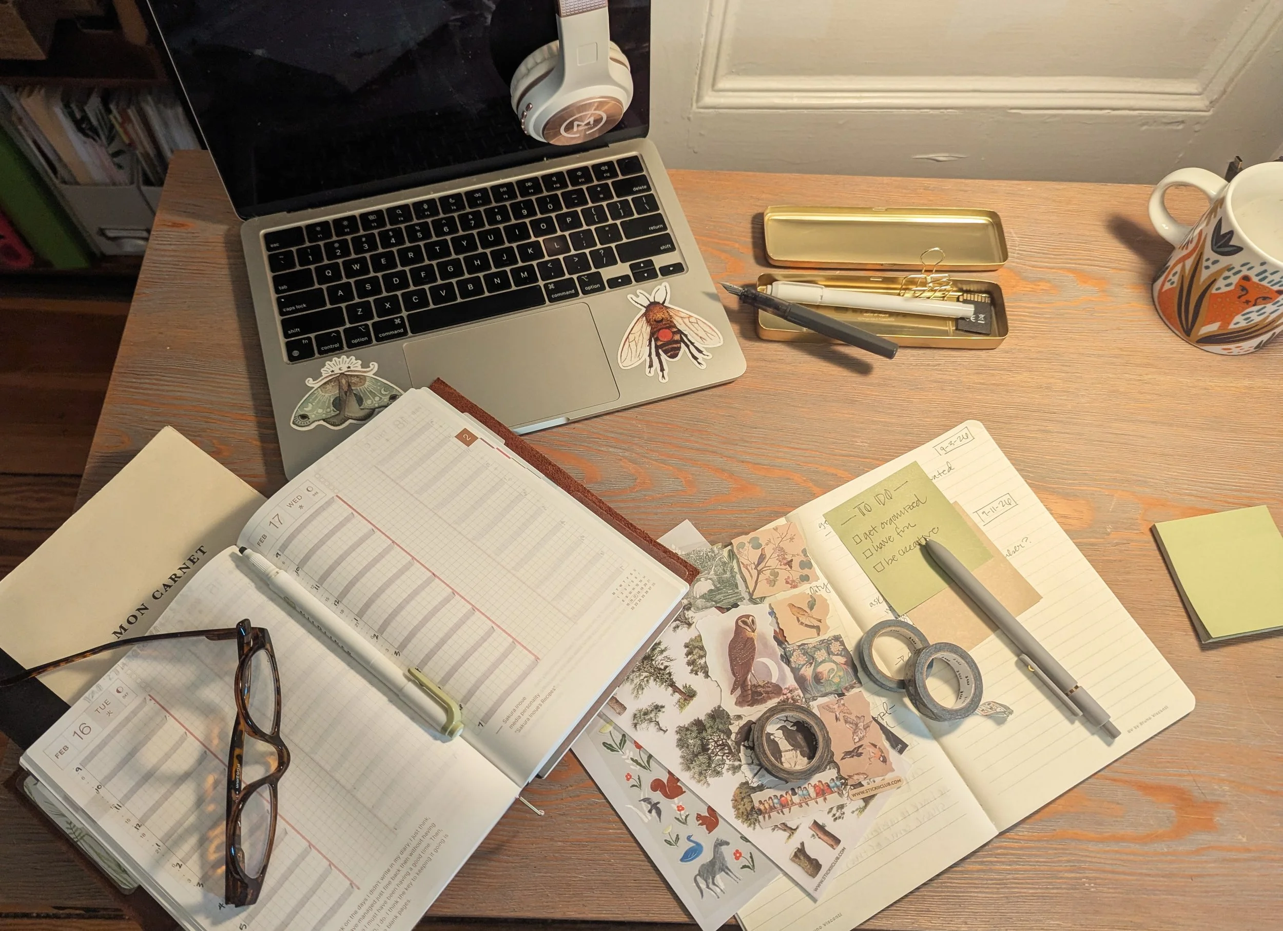 Desk with laptop, planner, and tools for organization & study