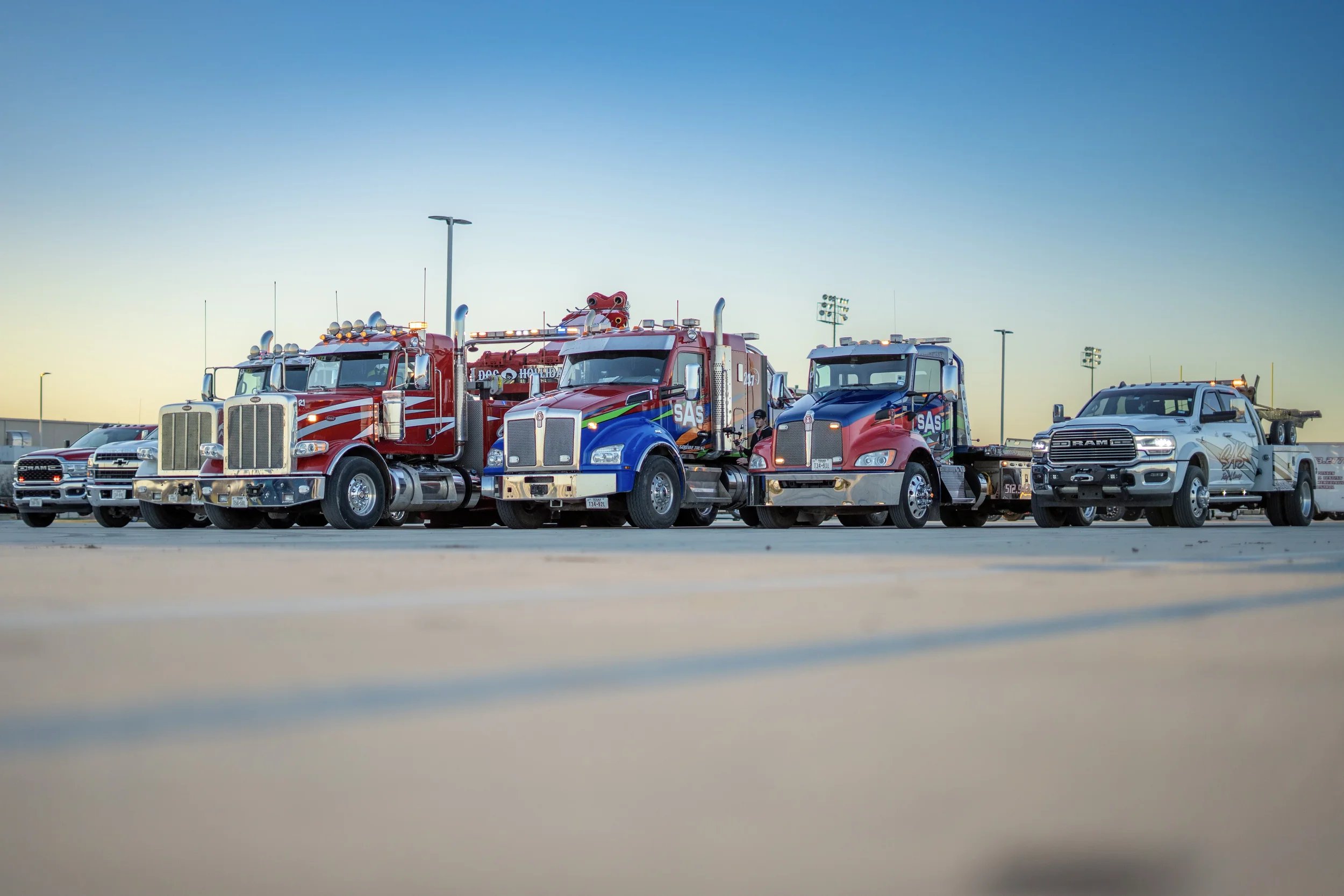 SAS Road Solutions towing and recovery fleet lined up at a Central Texas facility