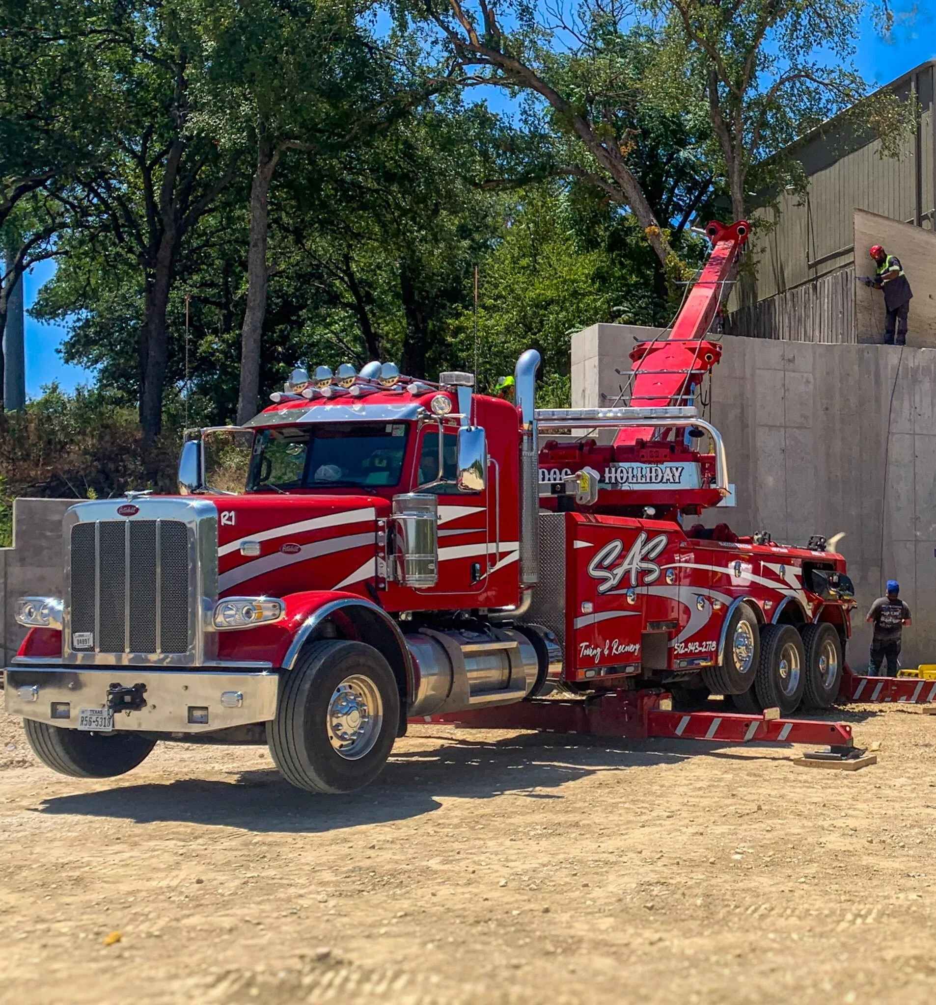 Red SAS Road Solutions heavy-duty tow trucks positioned for commercial vehicle recovery