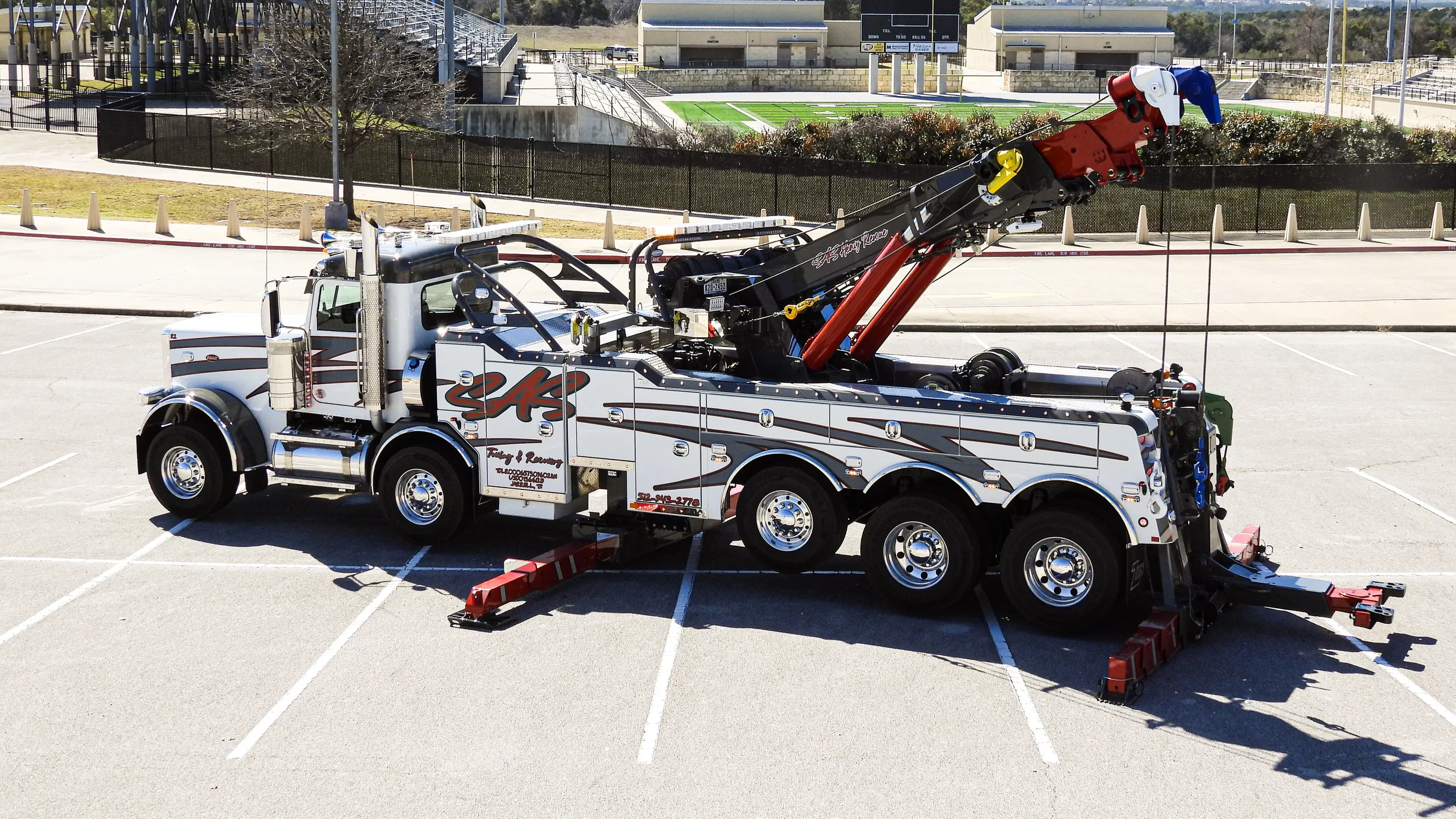 SAS Road Solutions heavy-duty rotator tow truck positioned for commercial vehicle recovery