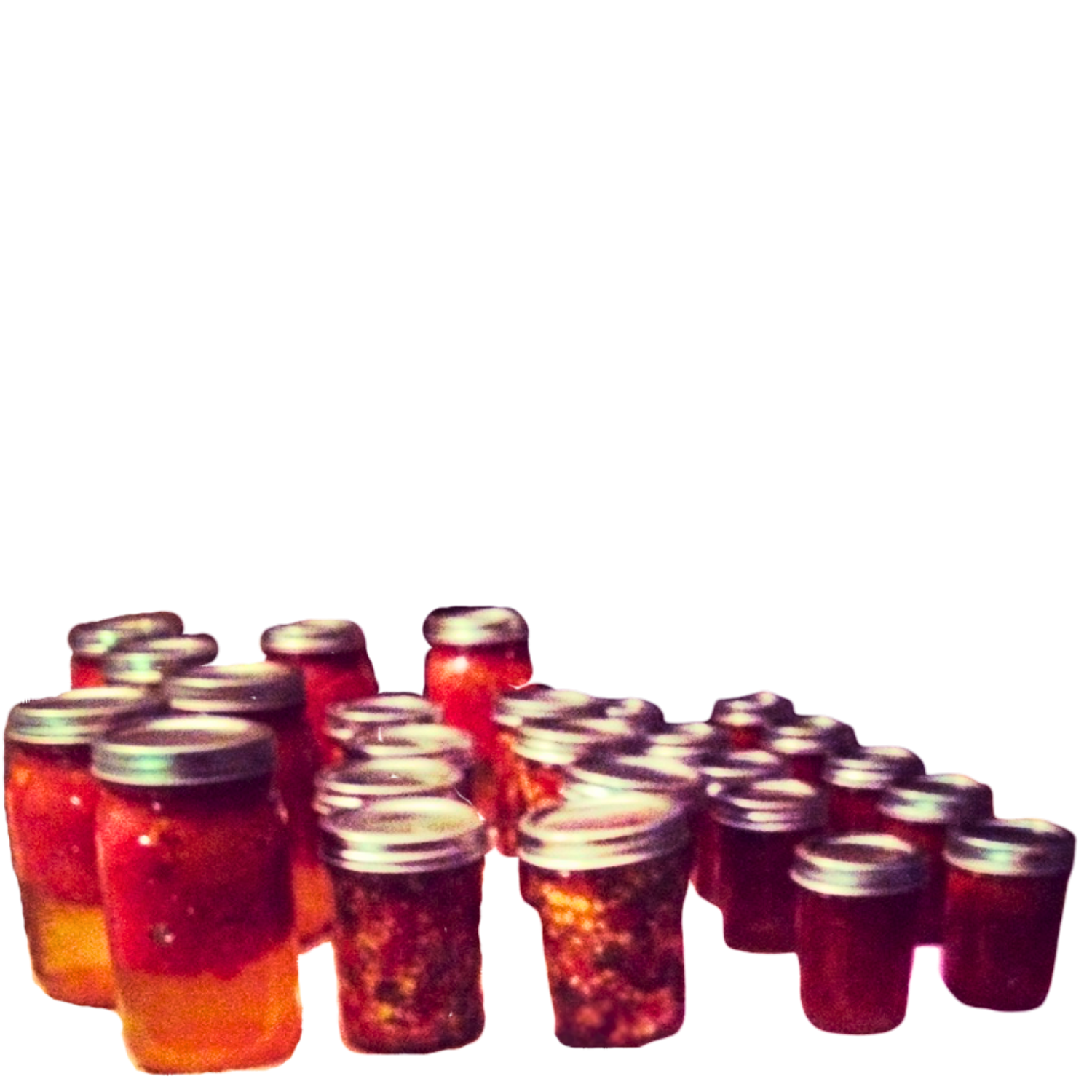 Several ball jars with metal lids, filled with salsas, jams, and tomatoes.