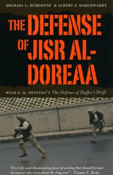 Book cover titled 'The Defense of Jisr al Doreaa' by Michael L. Burgoyne and Albert J. Marckwardt, featuring a photo of soldiers running on a street route.