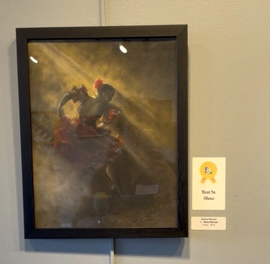 Painting of a solo dancer in a red dance costume performing on stage with dramatic lighting. Won Best in Show Award at Broward Art Guild, Florida. Artist: Kamila Marrero. Medium: Soft Pastel.