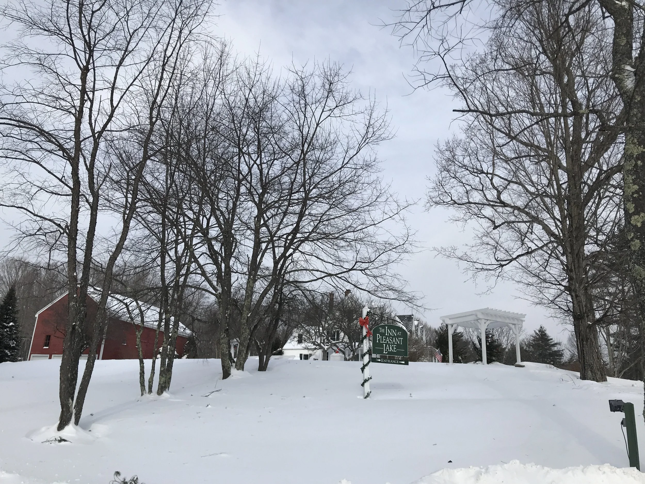 The Inn at Pleasant Lake entrance sign in the snow.