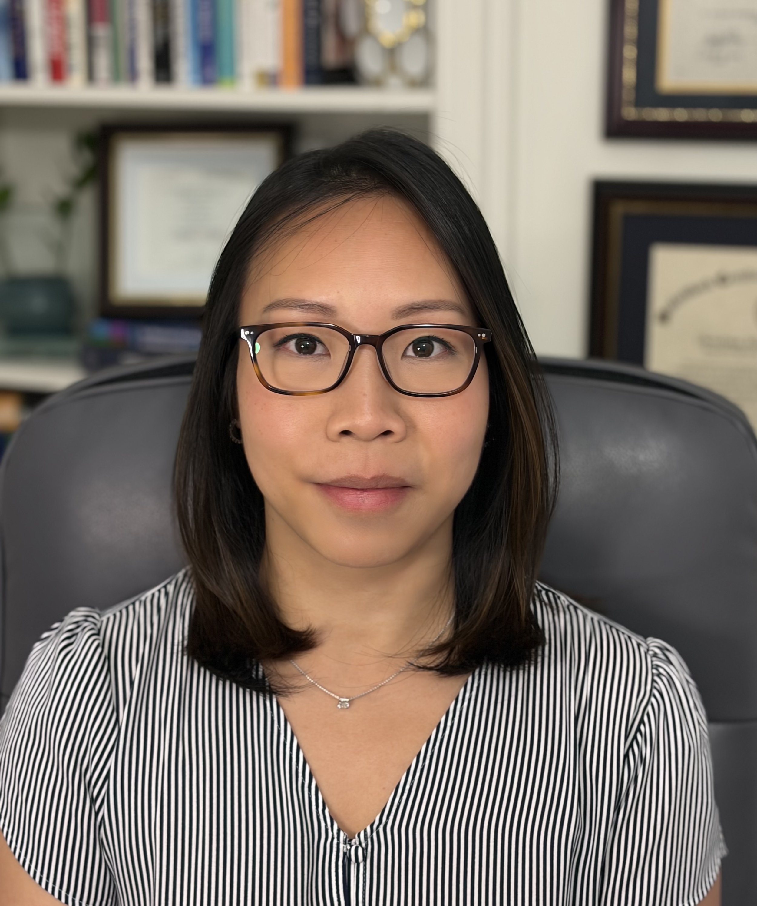 Dr. Christina Hong-Huber seated in her office.