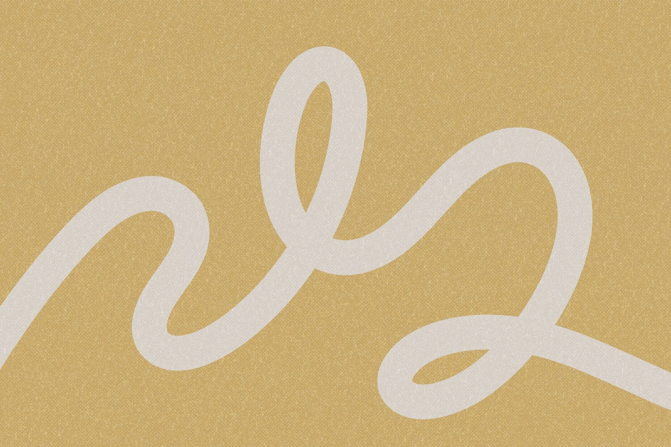 Close-up of a golden paper with the word 'love' written in white cursive script.