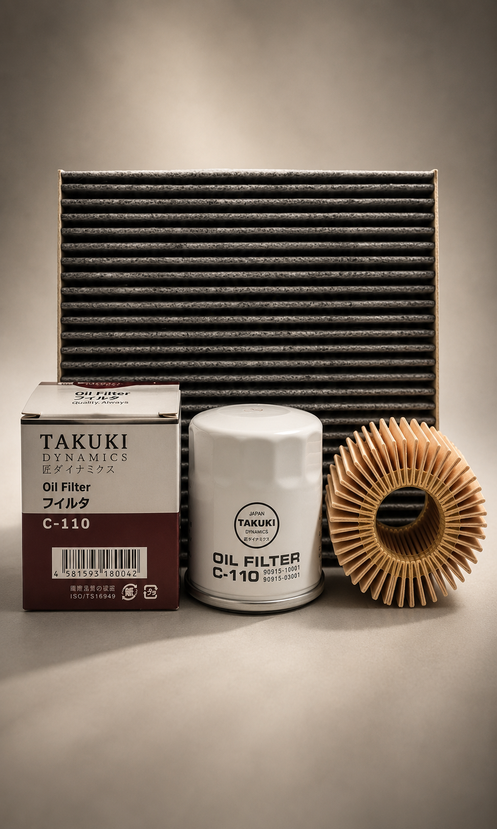 Car oil filter parts including a large air filter, an oil filter with label, and a pleated paper filter element, arranged on a neutral surface.