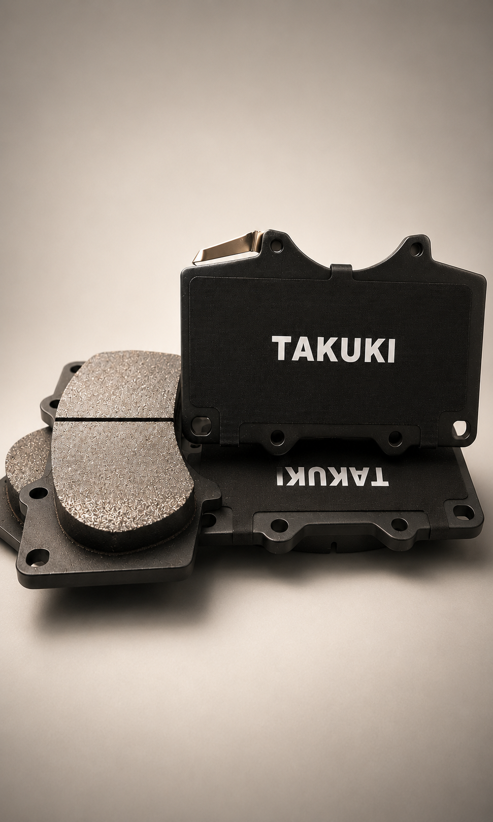 A set of Takuki motorcycle tools, including a black case with the brand name in white, and metal grinding or polishing stones on a white surface.