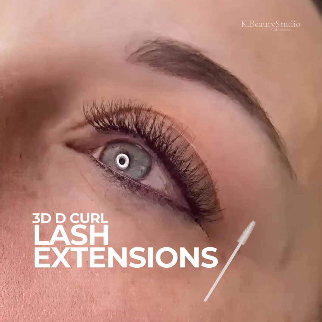 Close-up of a woman's blue eye with lash extensions and shaped brows. Text overlays include "3D D Curl Lash Extensions" and a small image of a mascara wand, with a watermark in the top right corner reading "K. Beauty Studio Aberdeen."