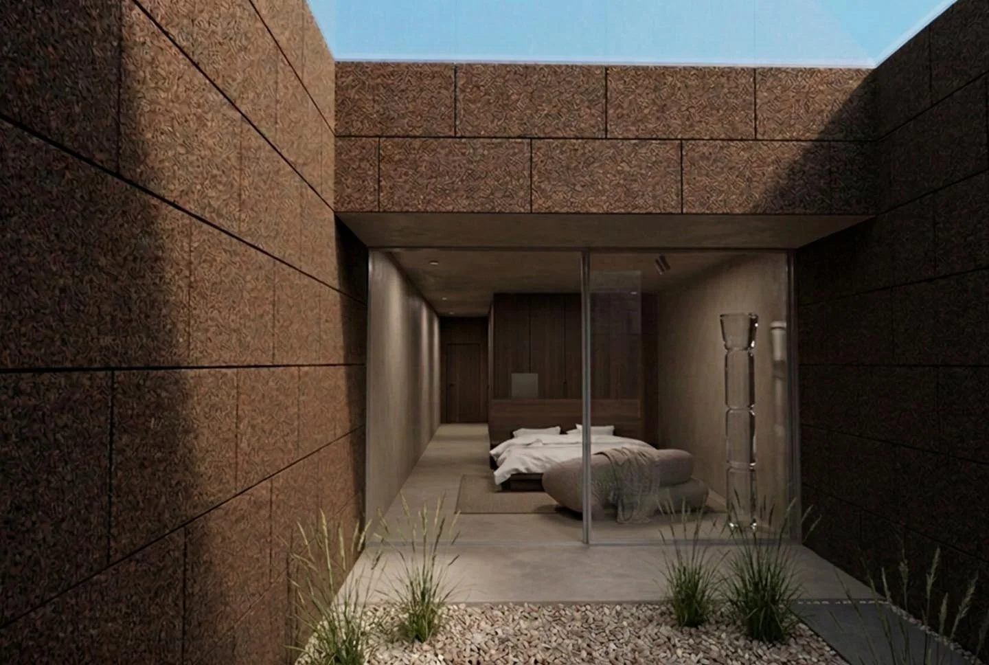Modern bedroom visible through a glass sliding door, with a bed, side table, and decor in neutral tones, outside a building with brick and stone exterior walls and small plants.