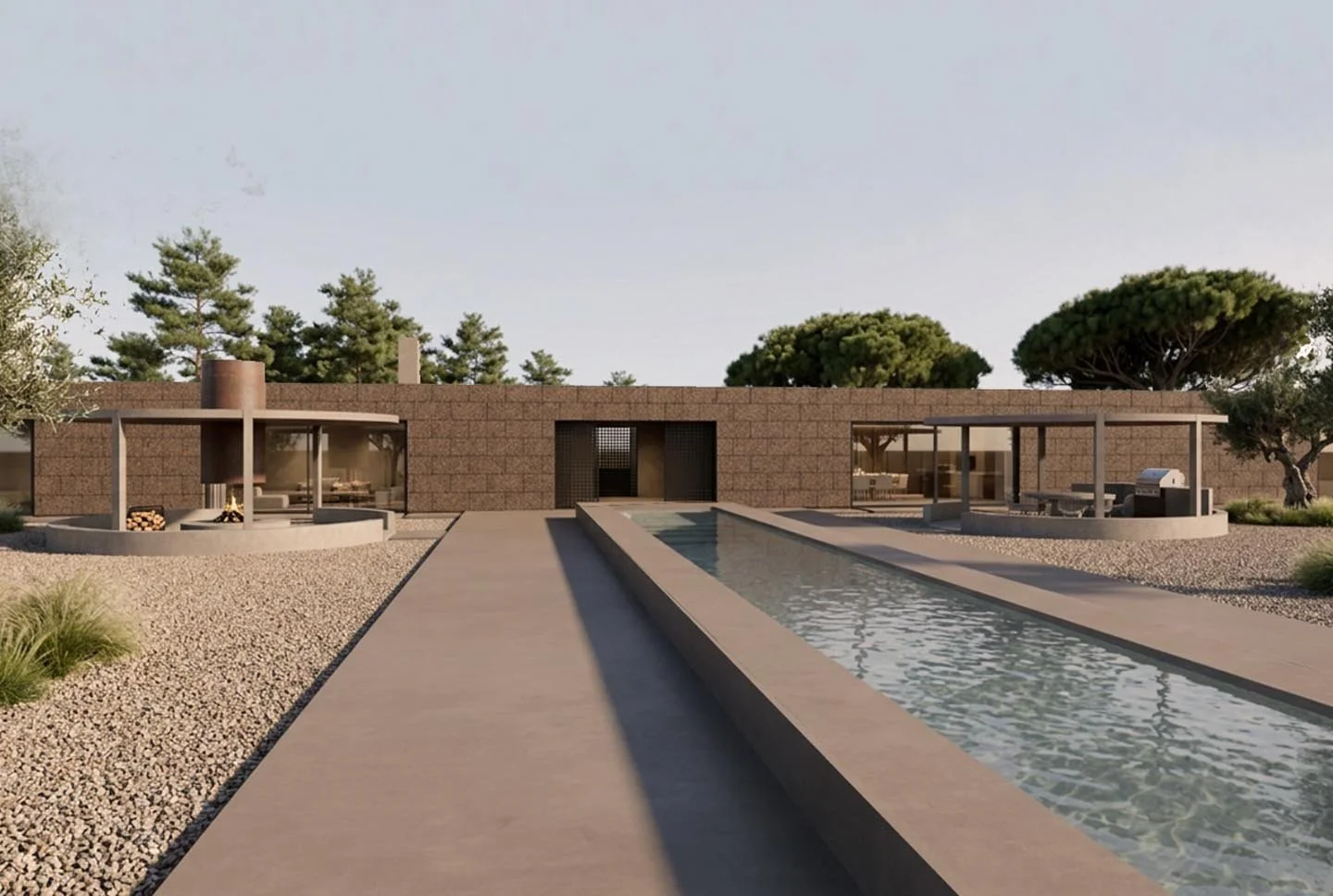 Modern backyard with a narrow rectangular pool, stone pathways, and a brick wall in the background. There are trees and outdoor seating areas with shade structures, and a grill on the right side.