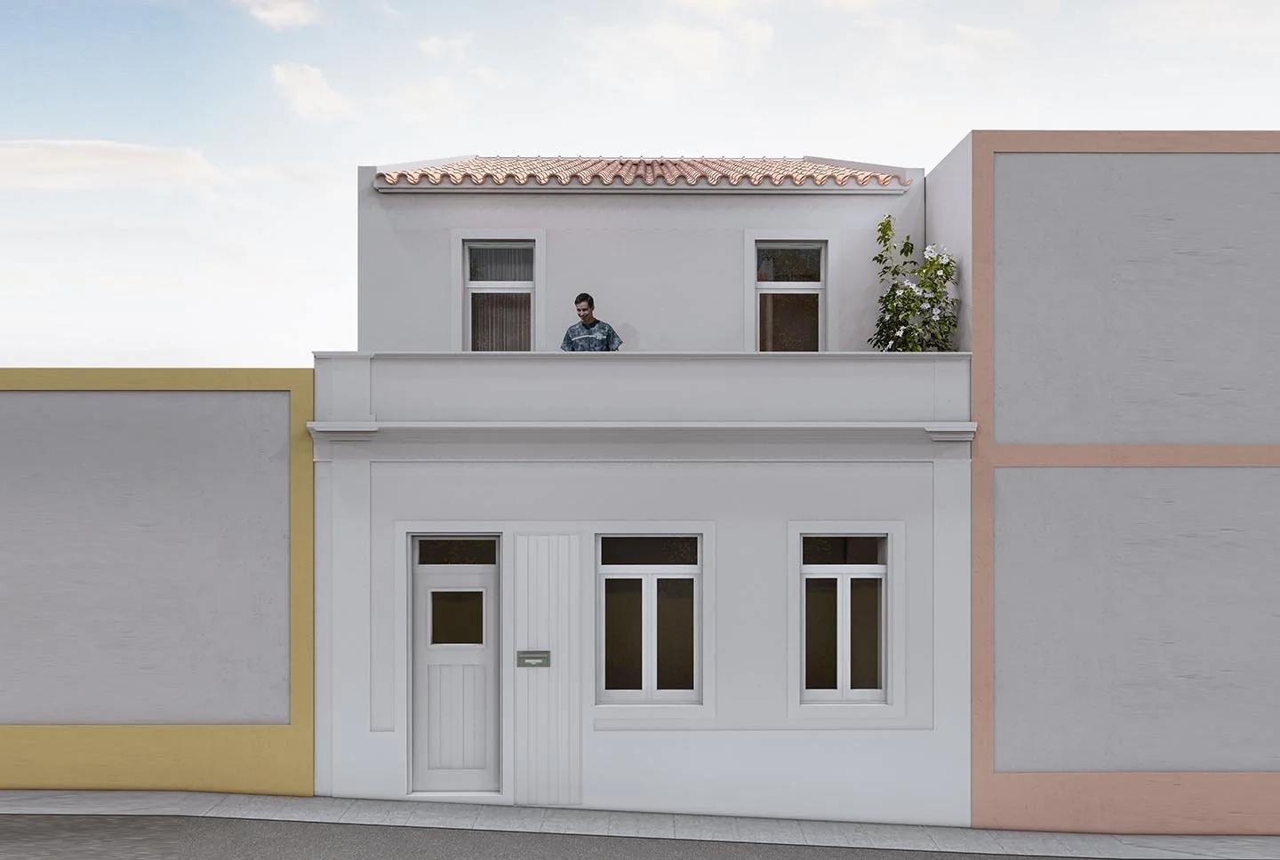Two-story white house with a tiled roof, three windows on the upper level, and two windows on the lower level, with a man standing on the balcony on the upper floor.