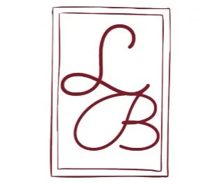 A stylized logo with overlapping red cursive letters L and B within a double-lined rectangular border.