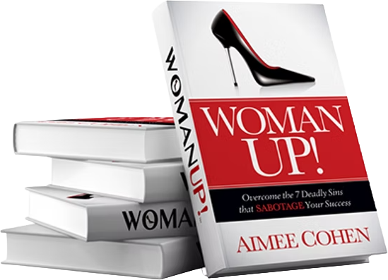 Stack of books titled 'Woman Up!' featuring a high heel shoe on the cover by author, Aimee Cohen