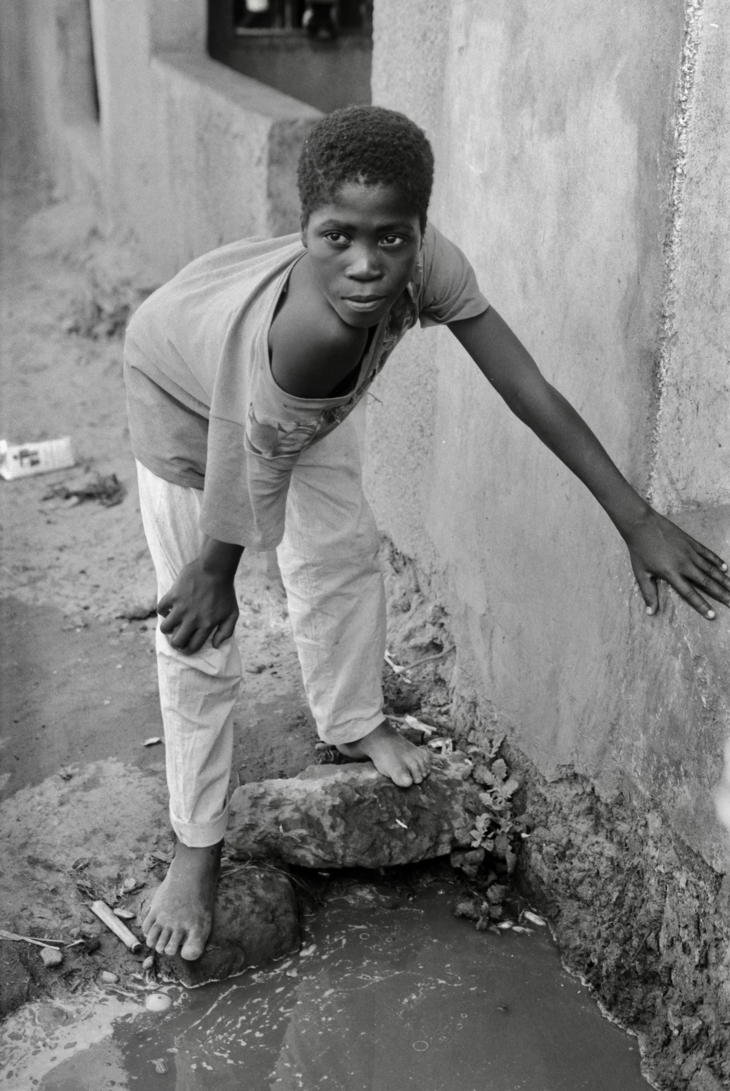 boy at community tap Zambia