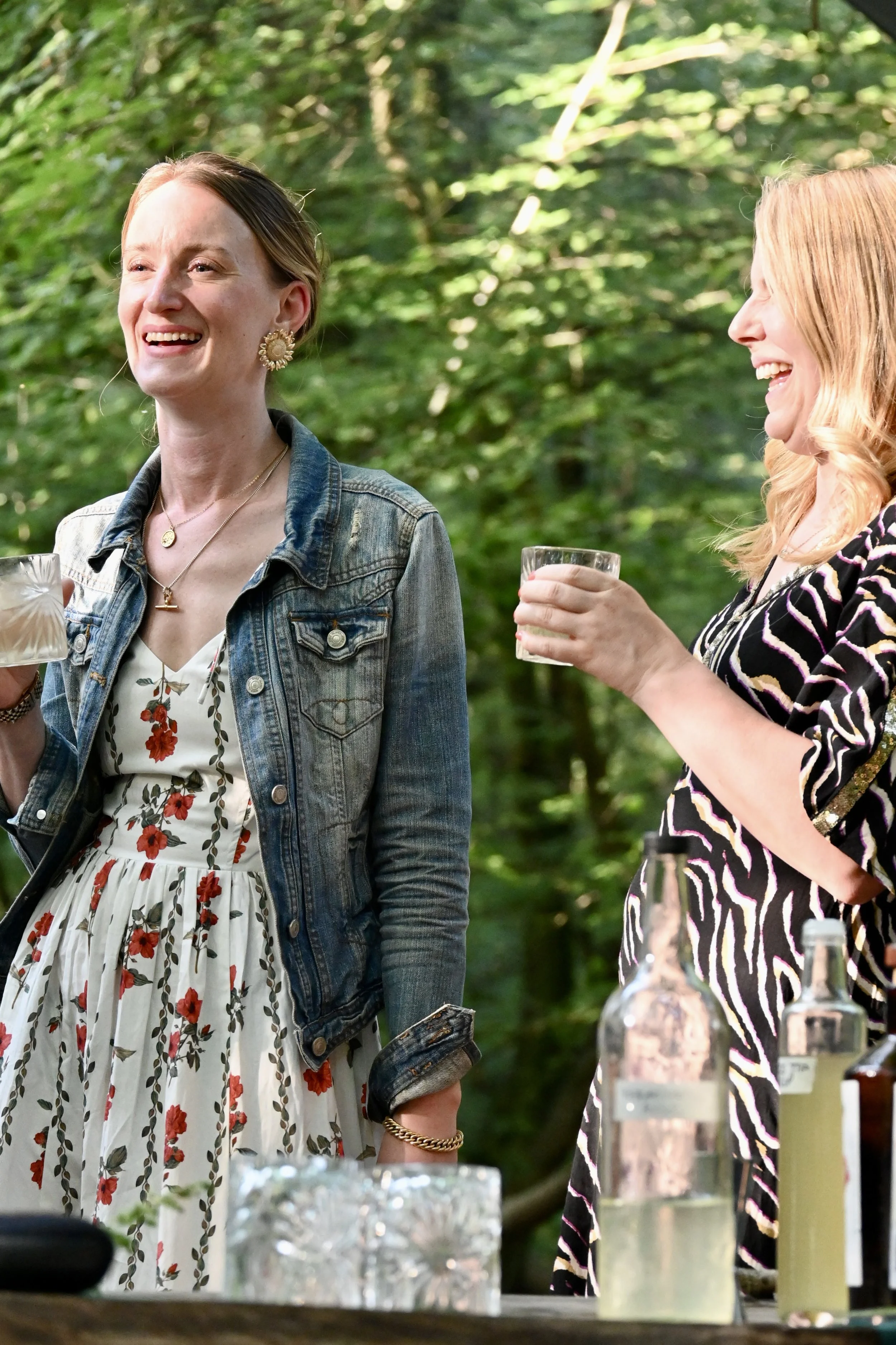 guests mingling at outdoor woodland feast Chilterns