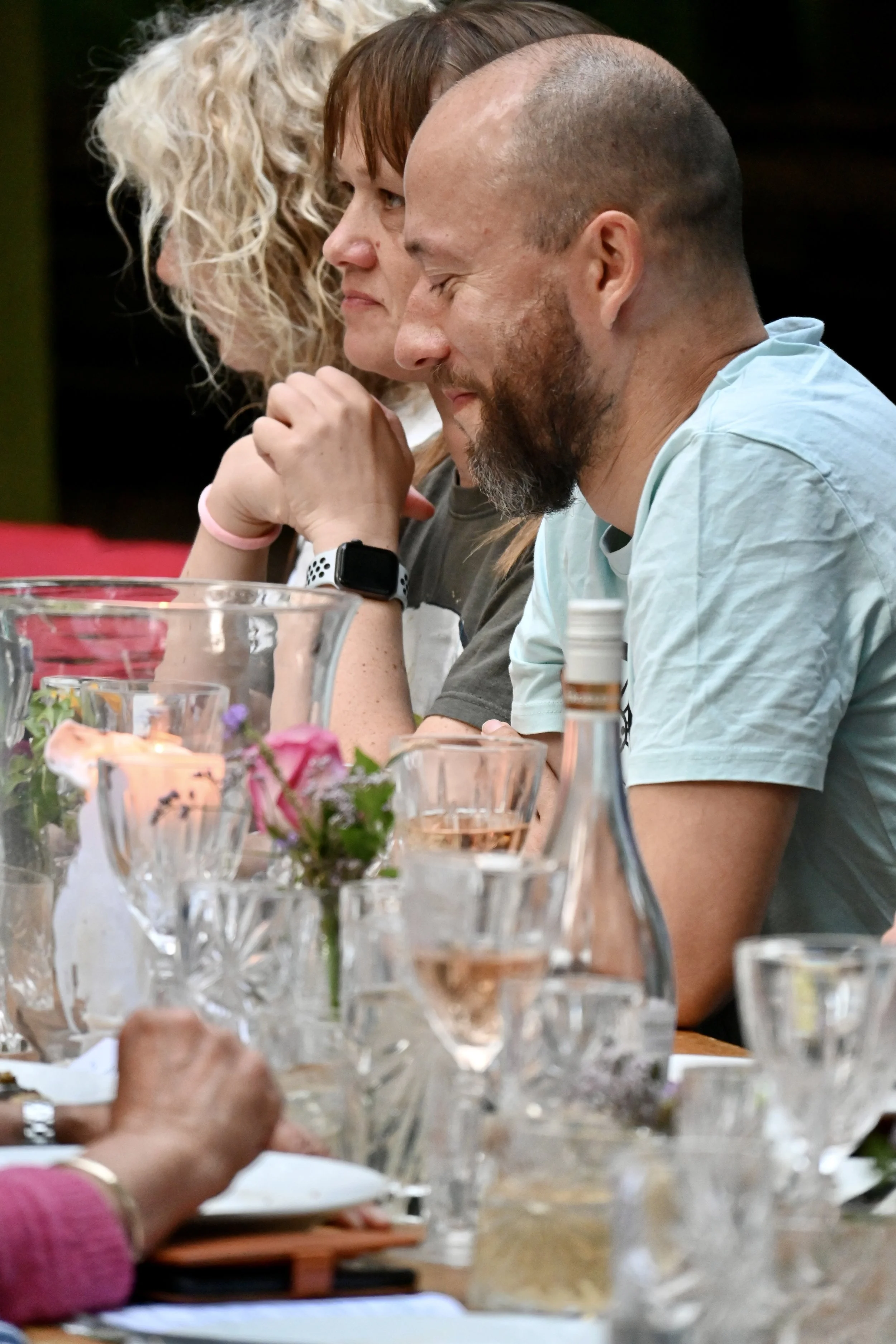 diners eating and drinking at outdoor woodland feast Chilterns