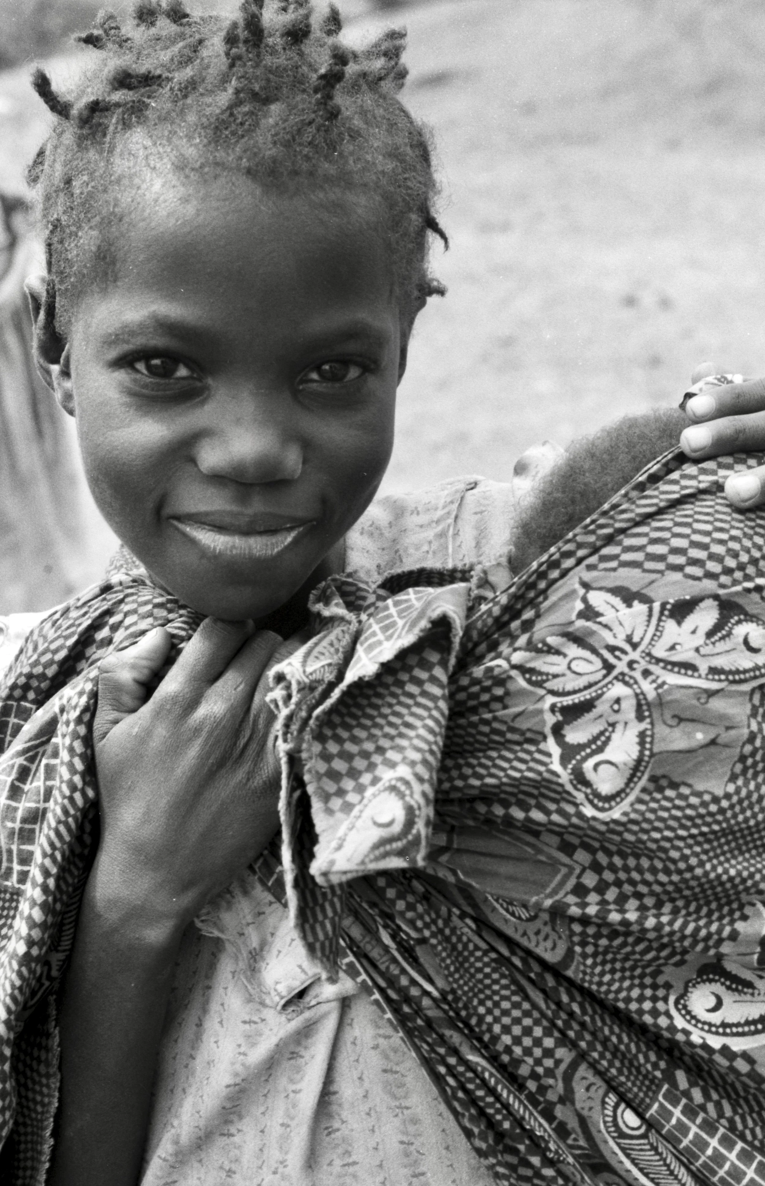 child carrying baby Zambia