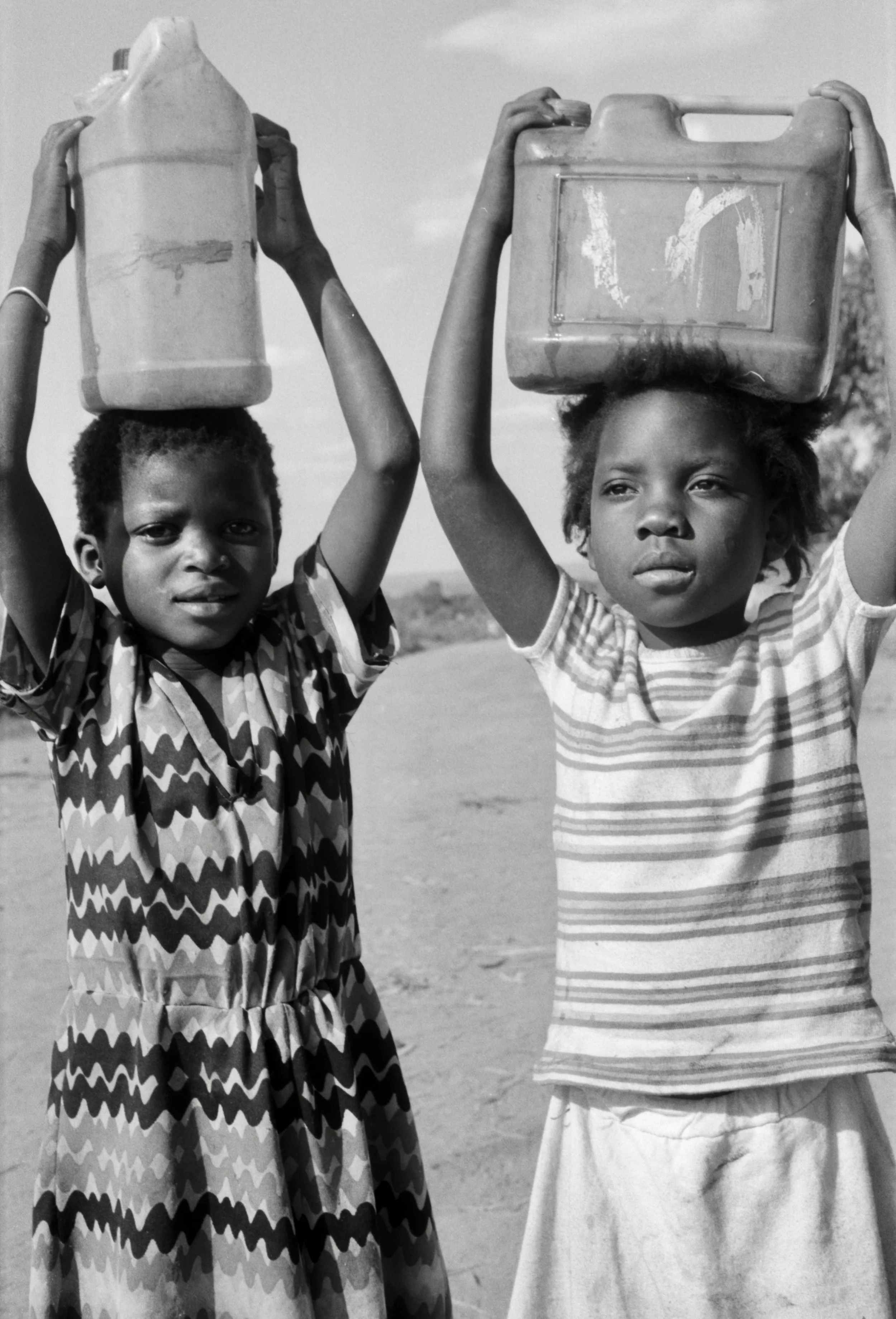 girls carrying water on heads Zambia