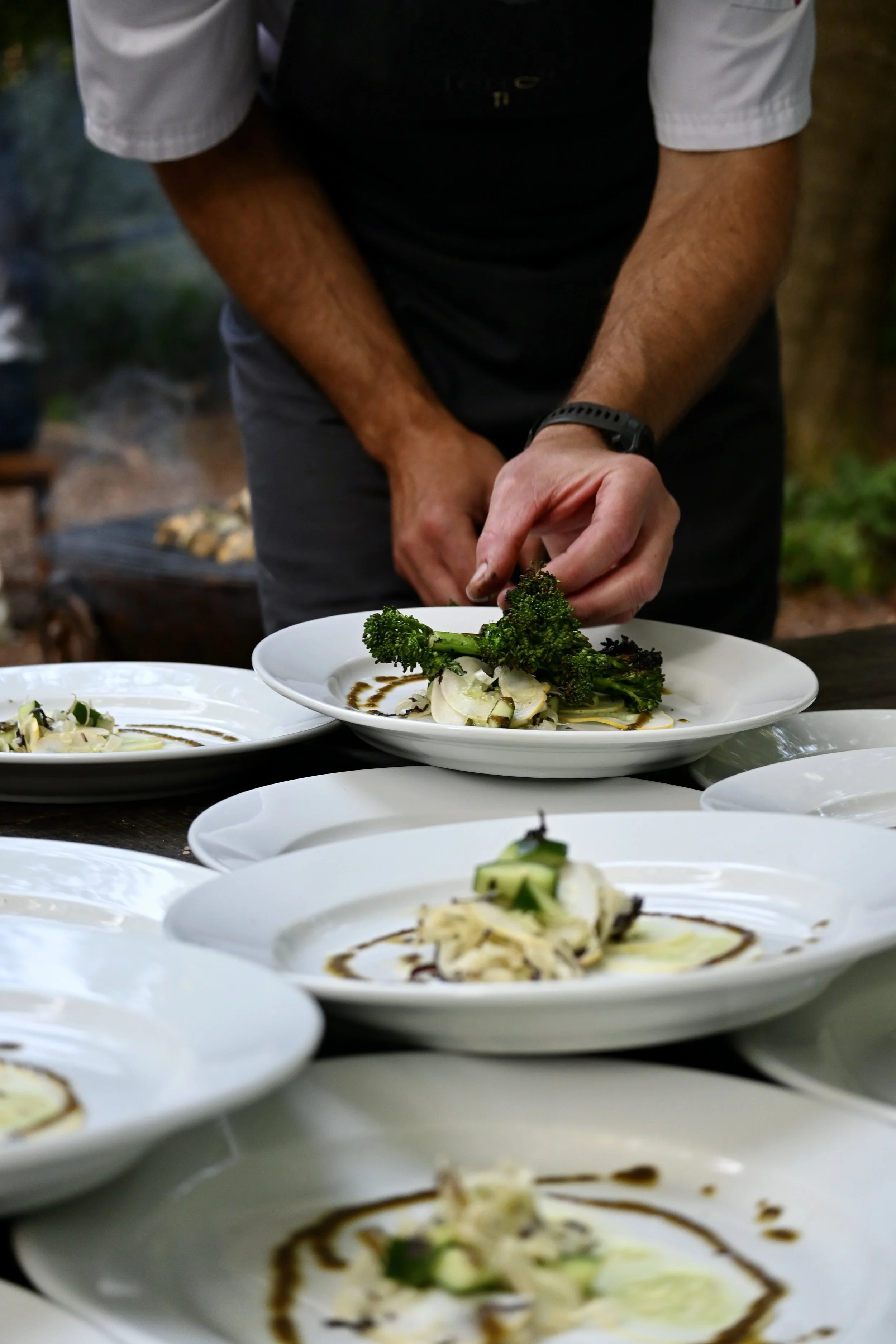 chef cooking over open fire Chilterns woodland