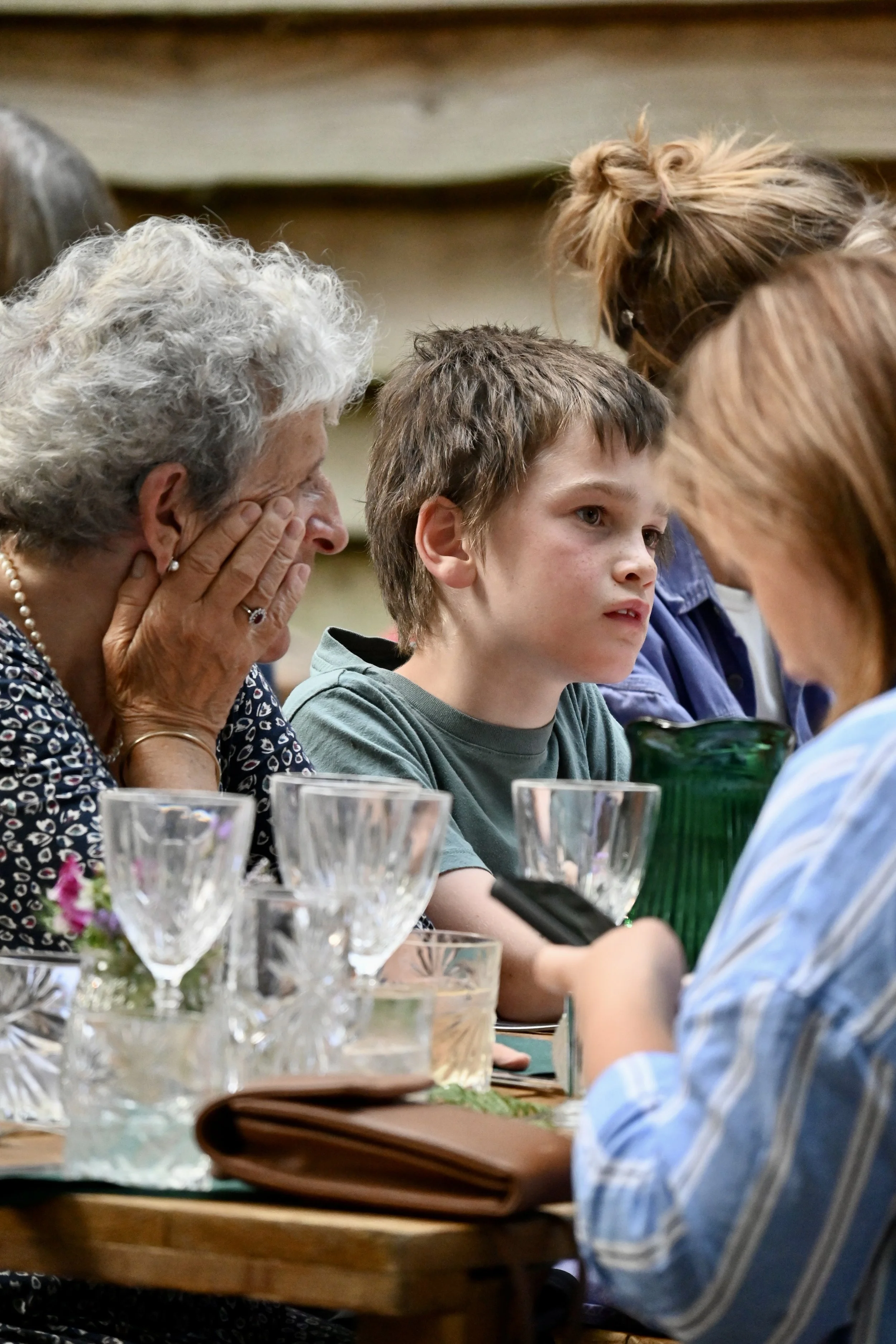 diners eating and drinking at outdoor woodland feast Chilterns