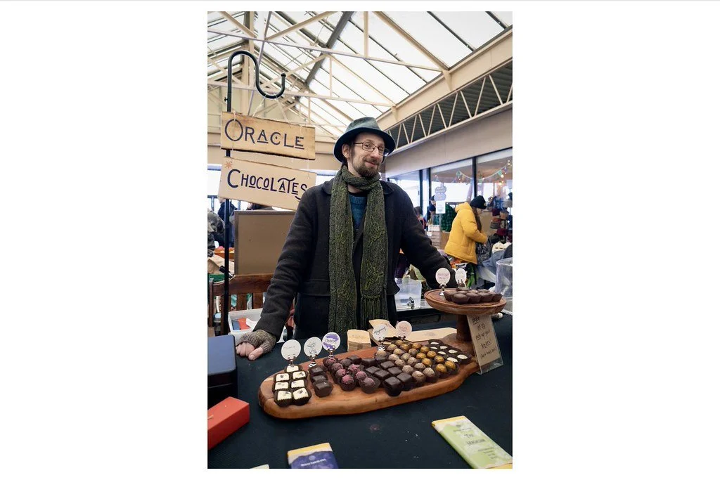 Brien Bianchi, chocolatier and founder of Oracle Chocolates in downtown Ithaca, N.Y., serves his homemade truffles at the Ithaca Farmers Market. Bianchi, who has more than 20 years of culinary experience, runs the business with his wife, Miranda Bian