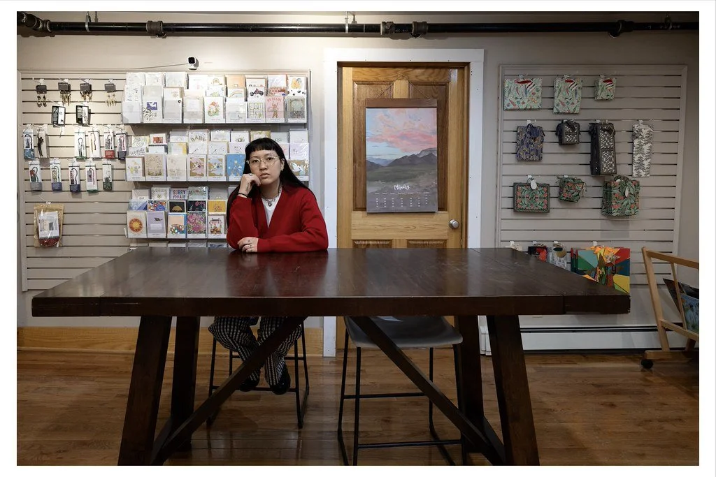 Paulina Yan, an employee at Mockingbird Paperie in downtown Ithaca, N.Y., waits for customers at her station. Yan has been working at the stationery store for three weeks.