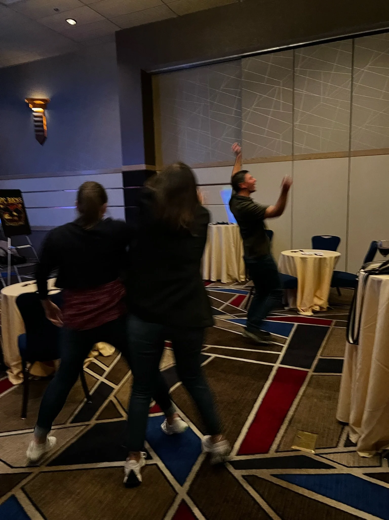 People dancing and having fun at an indoor event or party.