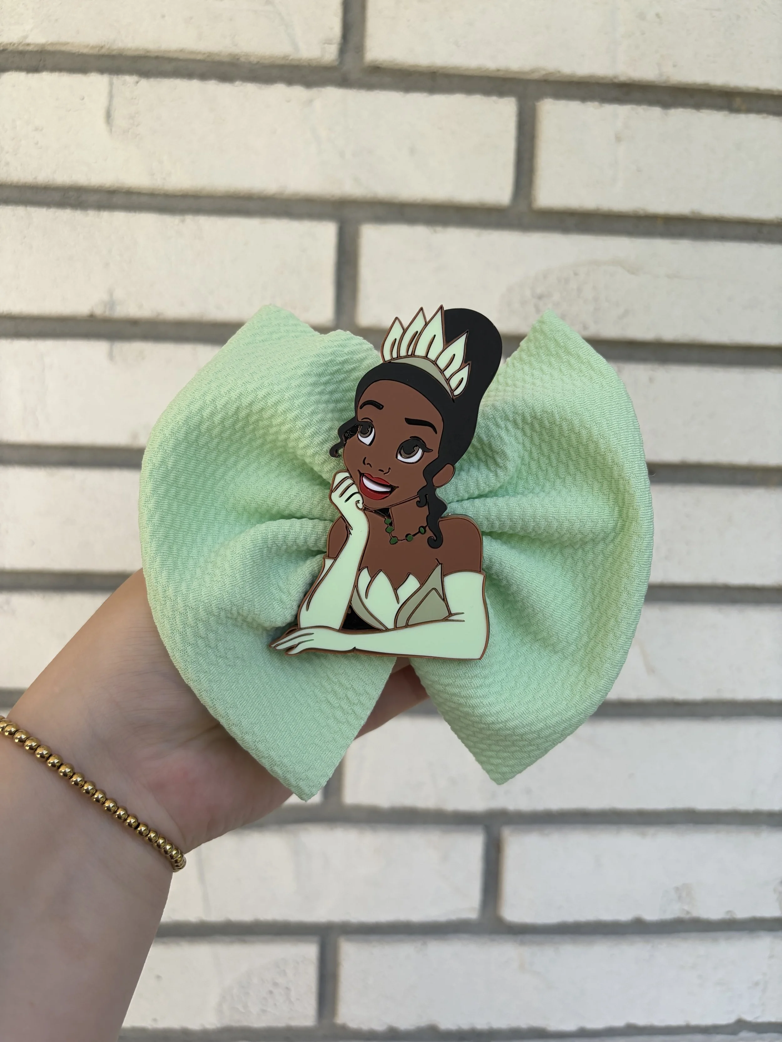 tiana and bow.jpeg