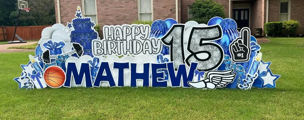 Colorful birthday yard sign with the name Mathew, celebrating his 15th birthday, featuring sports, celebration, and superhero themed decorations.