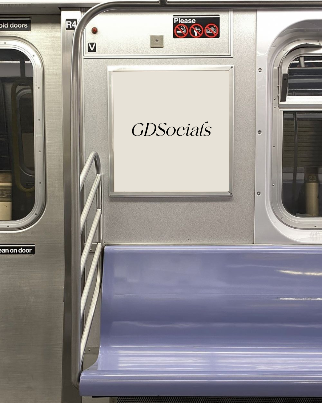 Interior of a subway train with a blank advertisement board displaying the text 'GDSocials' and various no-smoking, no-eating, no-drinking signs above the board.