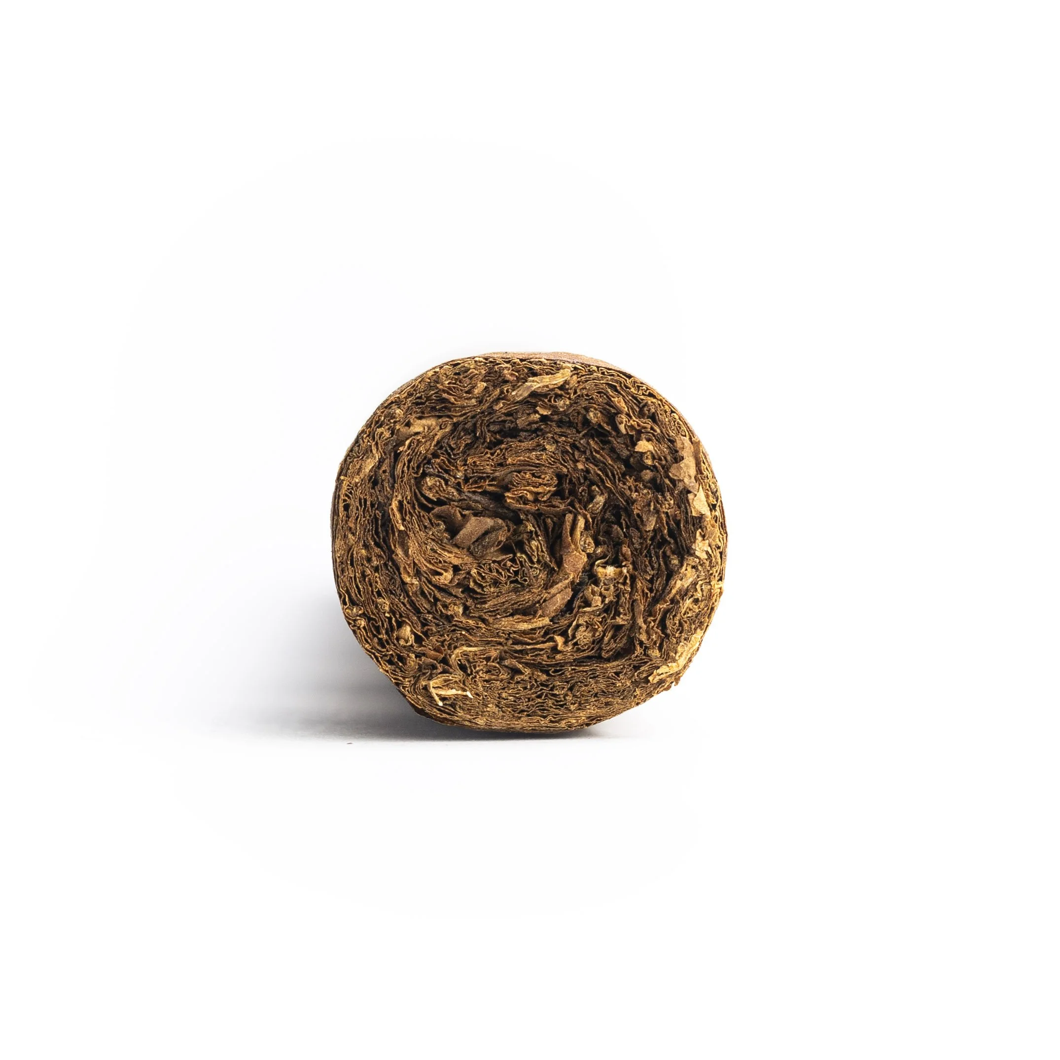 Close-up of a dark brown textured spherical object with intricate patterns.