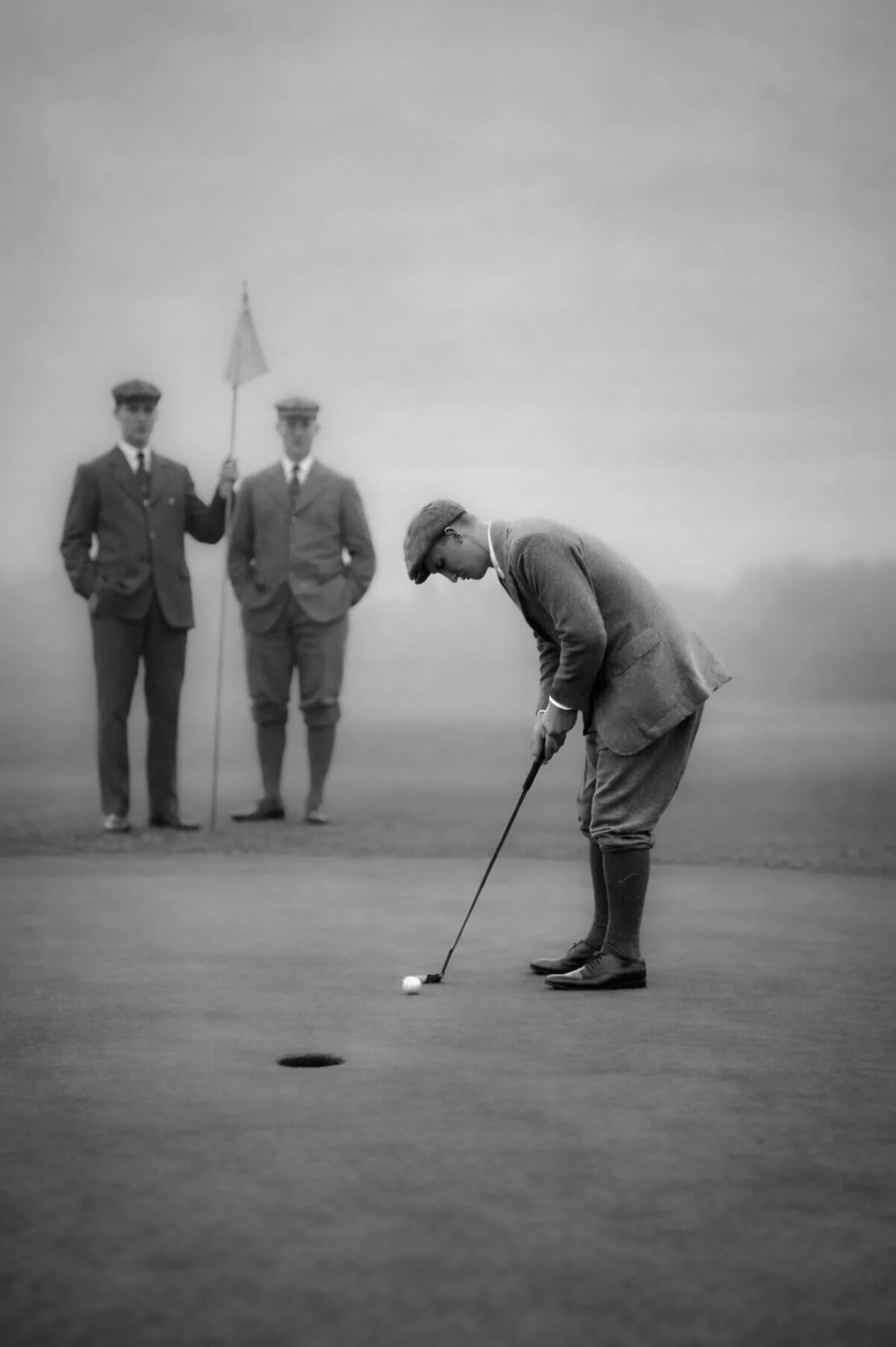 Black and white AI-generated golf wall art, vintage golfer putting near the flag in fog