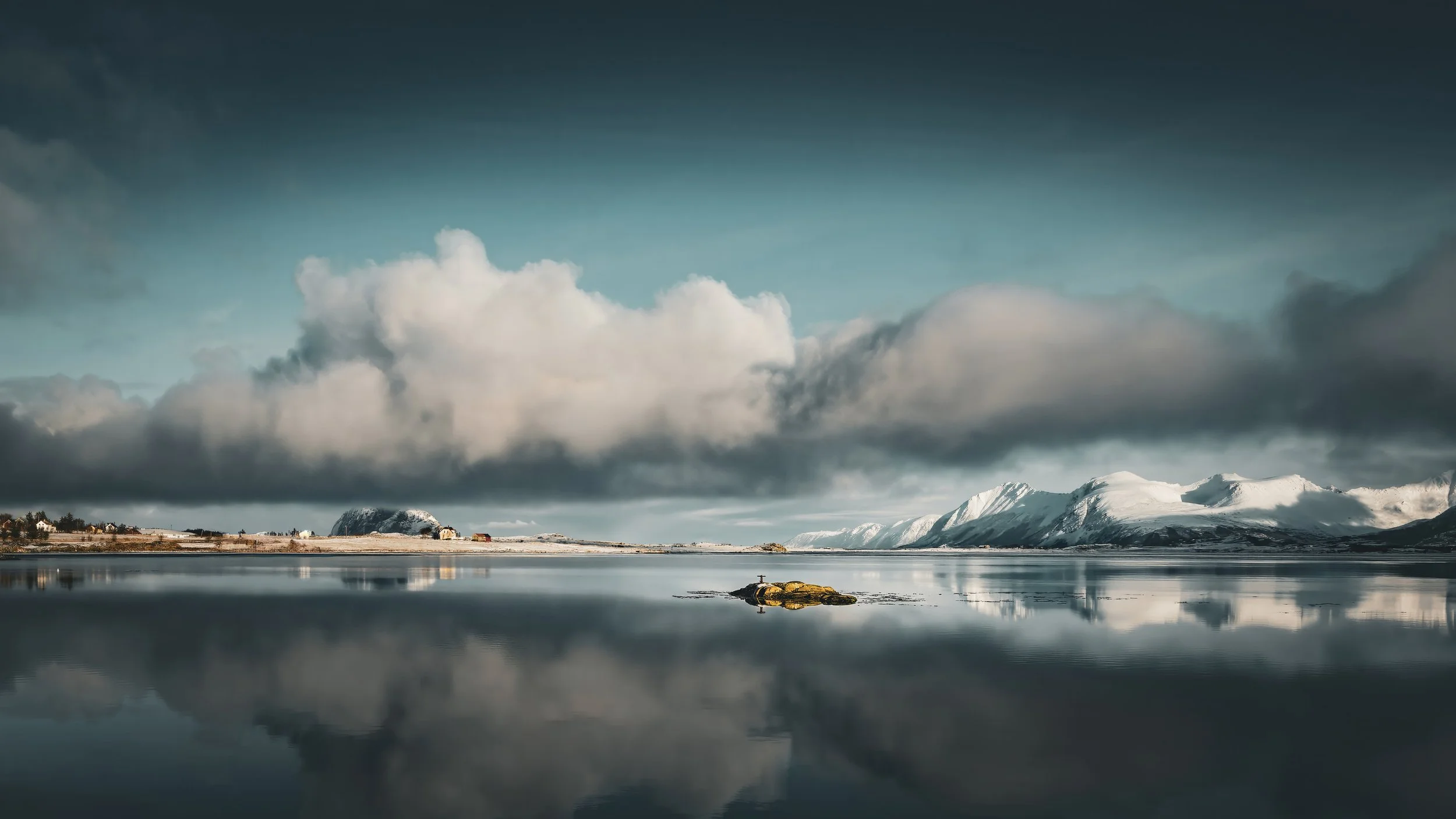 Teal and white Lofoten fjord landscape with a cloud reflected in still water and snow-covered mountains, Norway wall art