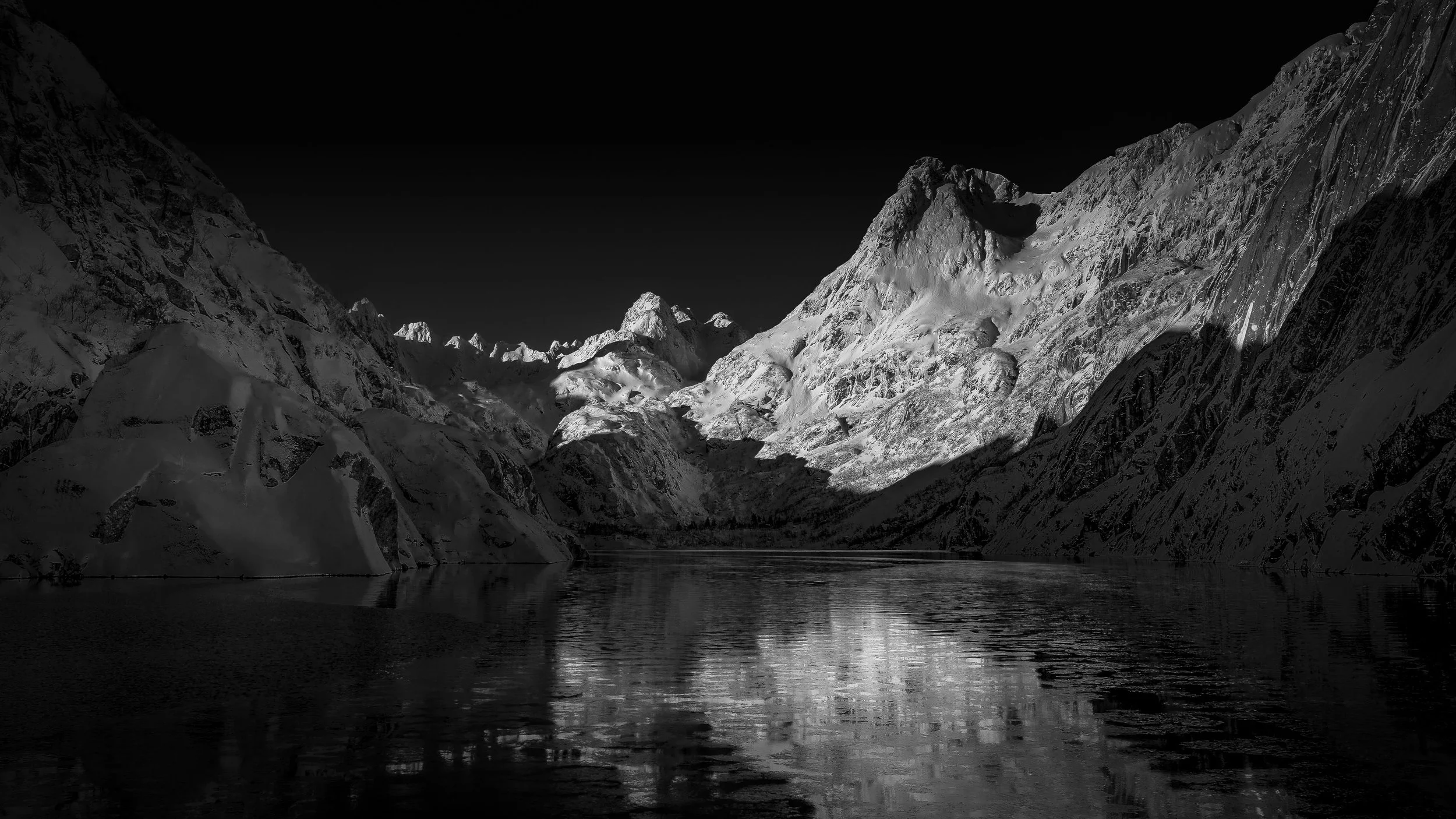 Snow-capped mountains and lake at night, Lofoten Islands, black and white landscape print